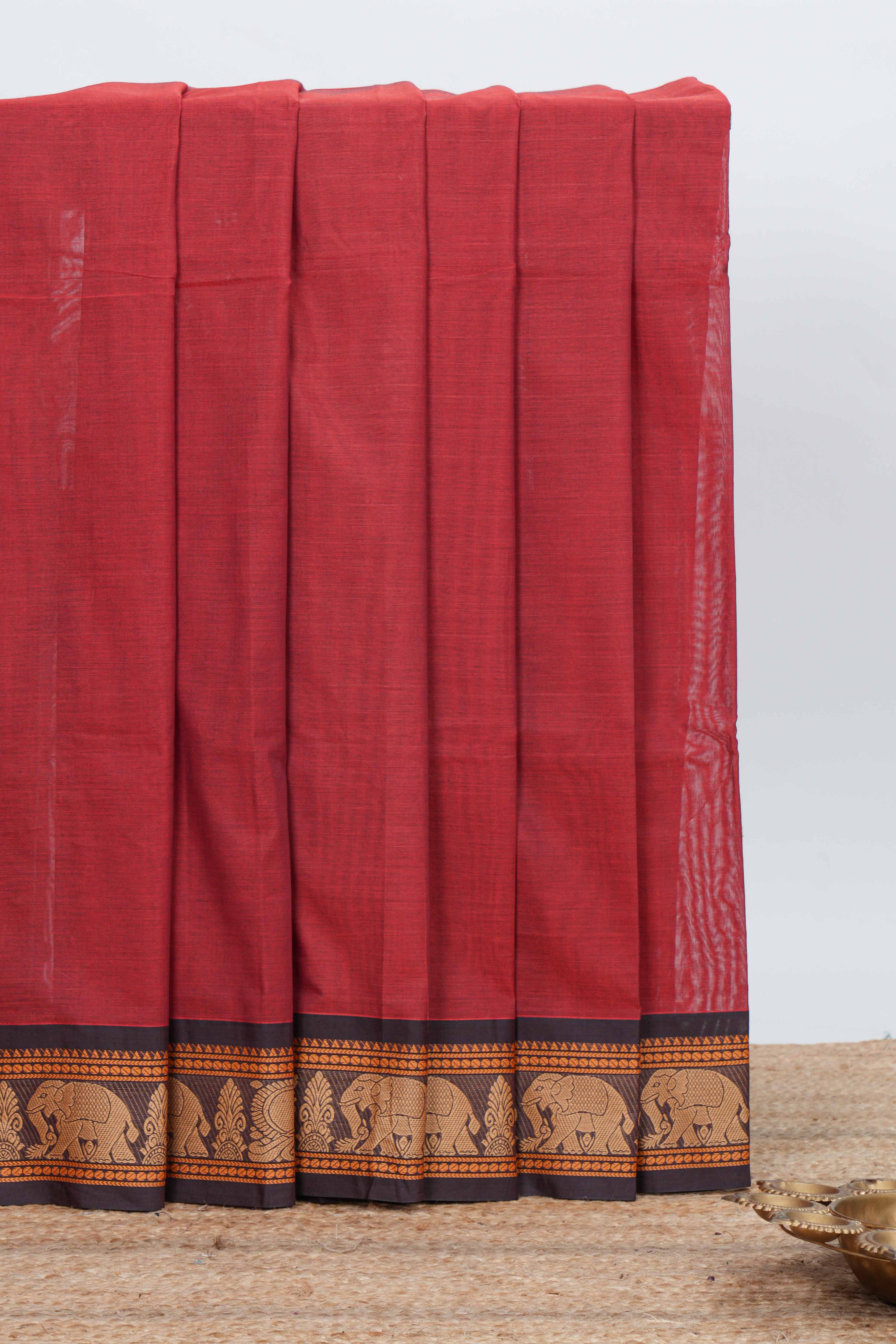 Red colour chettinad cotton saree plain body with contrast border and contrast pallu along with blouse piece