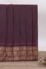 Deep coffee brown Chettinad cotton saree with a plain body antique gold zari elephant border along with matching blouse