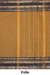Deep Mustard yellow Chettinad cotton saree with a plain body and a contrasting black border by antique gold zari motifs along with blouse piece