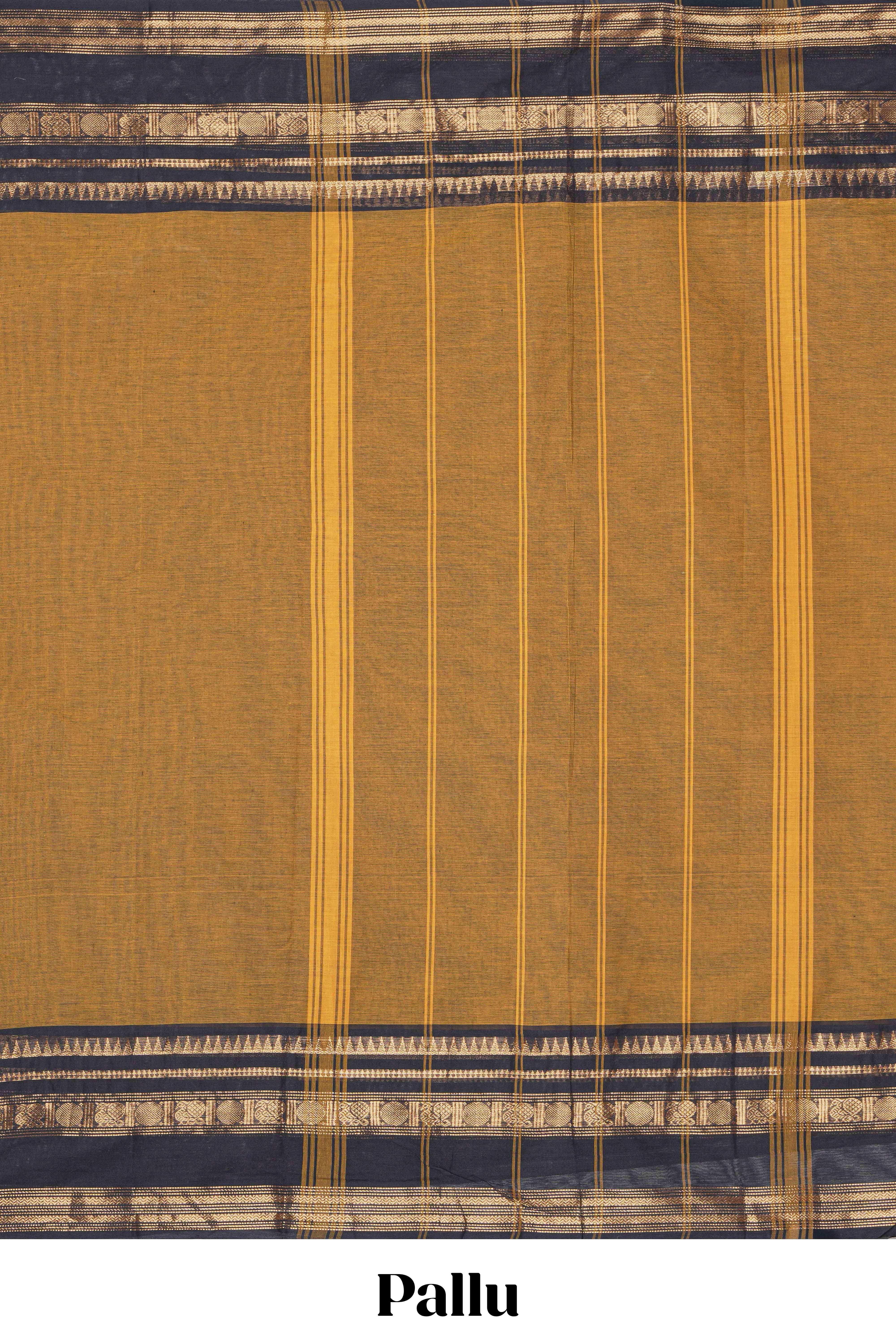 Deep Mustard yellow Chettinad cotton saree with a plain body and a contrasting black border by antique gold zari motifs along with blouse piece