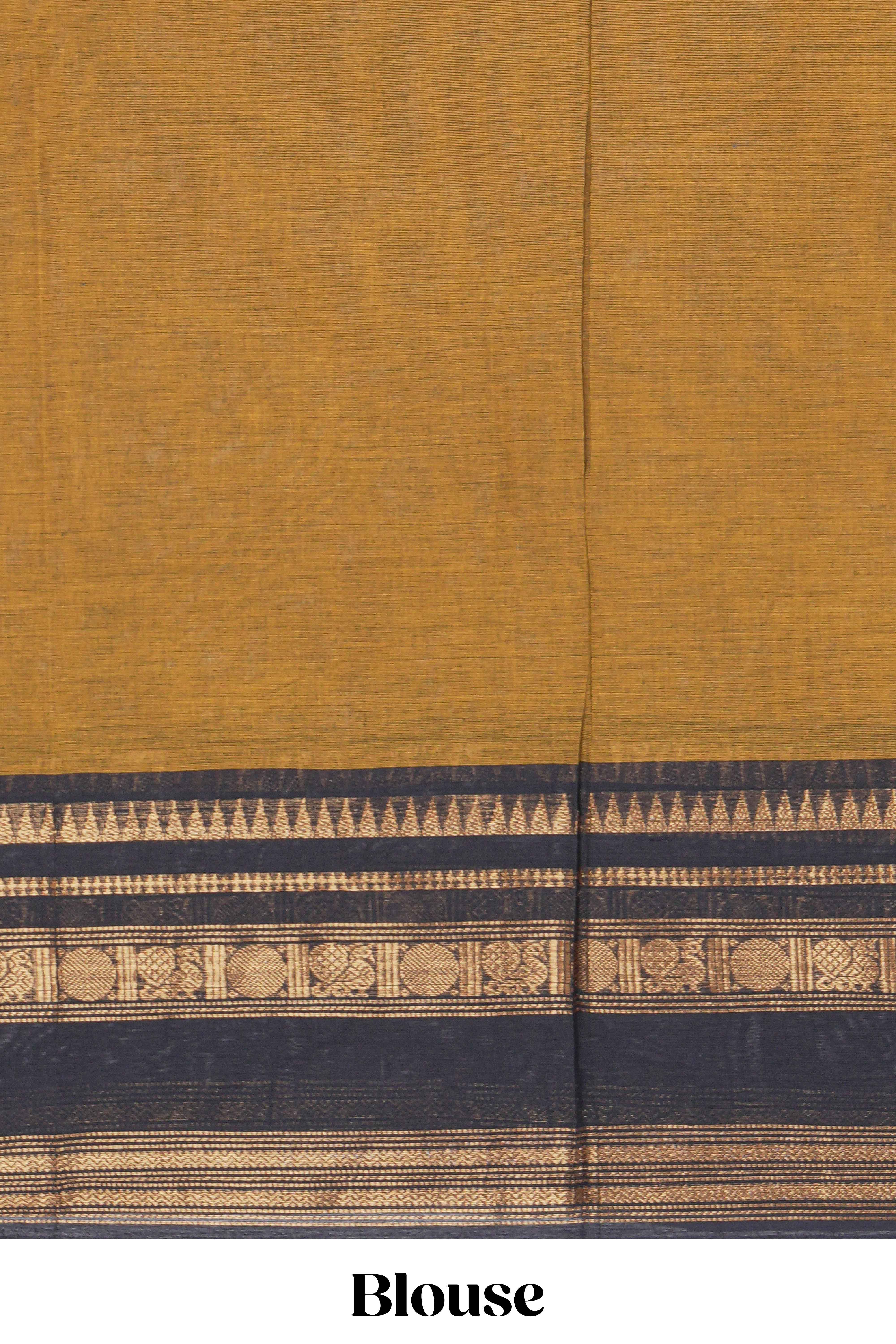 Deep Mustard yellow Chettinad cotton saree with a plain body and a contrasting black border by antique gold zari motifs along with blouse piece