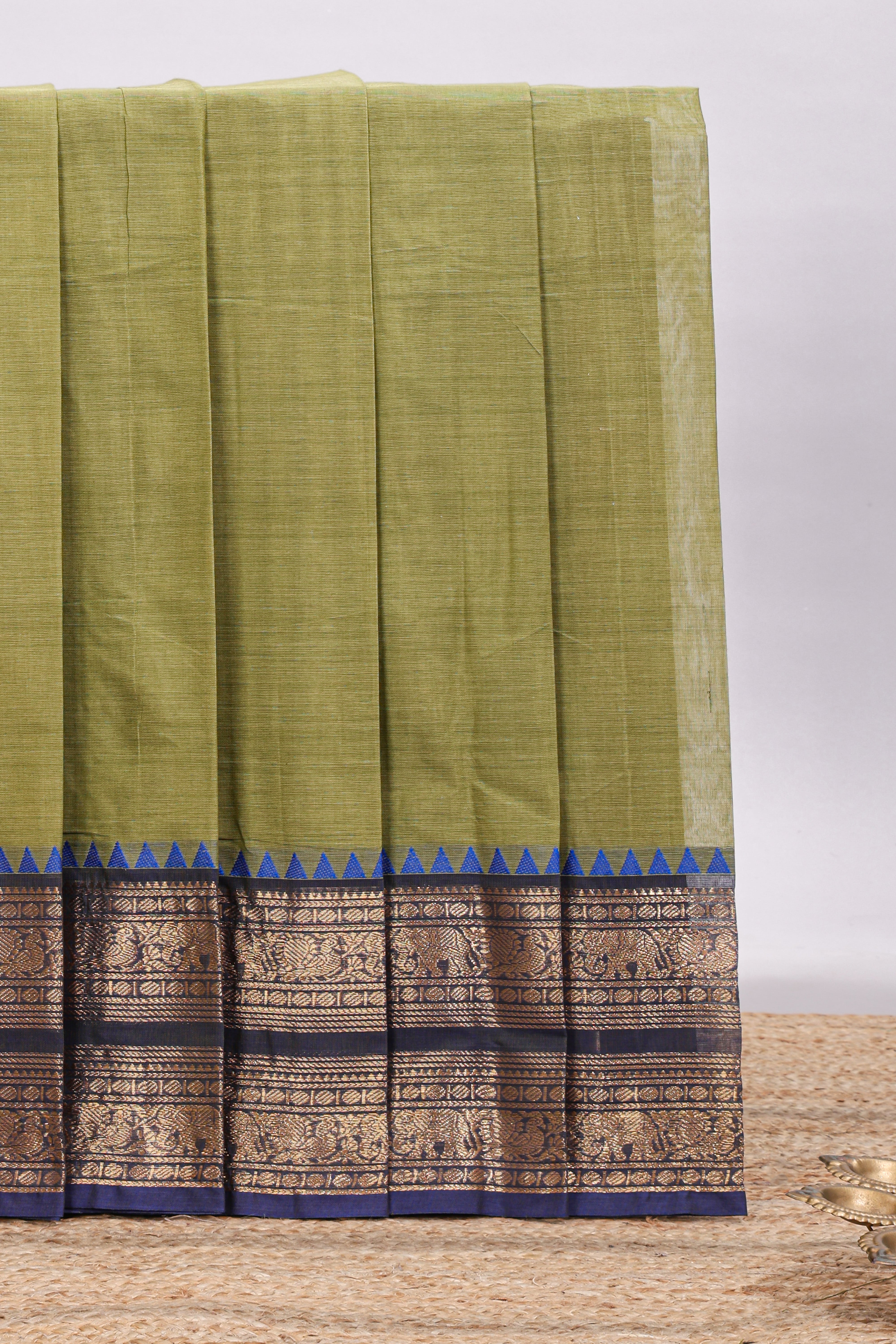 Olive green plain chettinad cotton saree with contrast bentex zari border and matching blouse