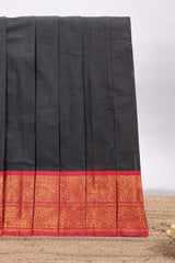 Black plain chettinad cotton saree with contrast zari border and matching blouse