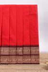 Red plain chettinad cotton saree with contrast zari border and matching blouse