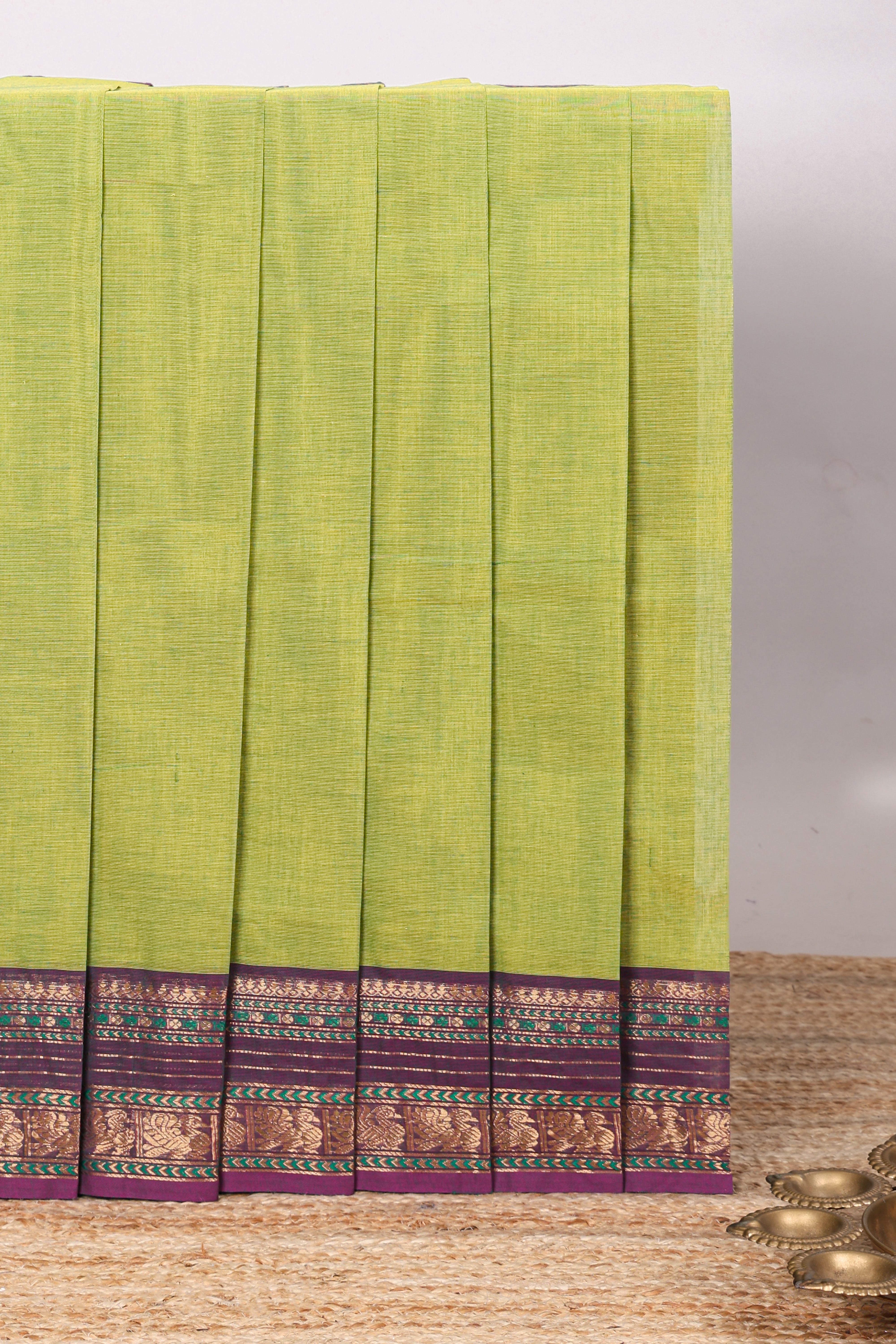 Green plain chettinad cotton saree with contrast zari border and matching blouse