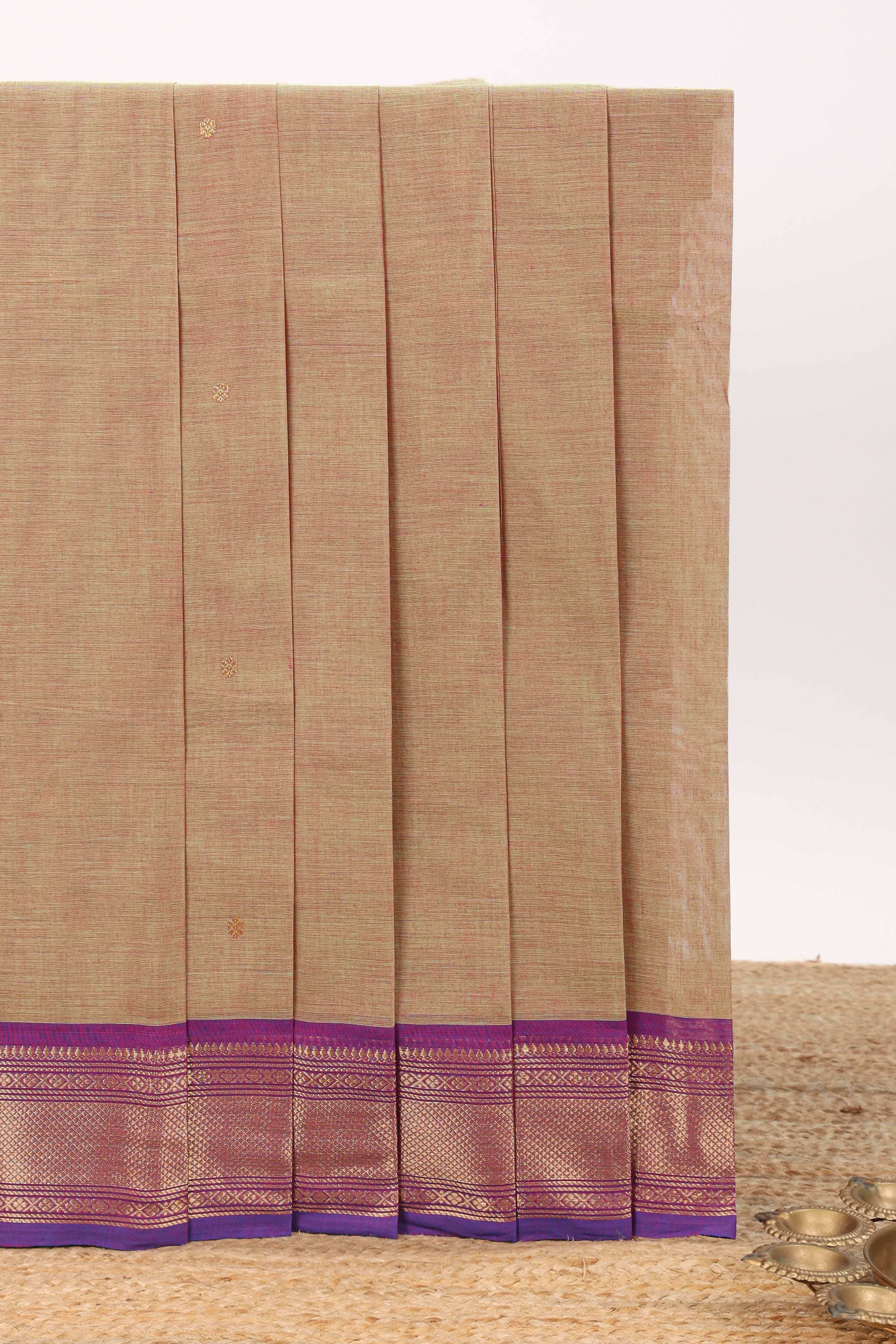 Beige motifs design chettinad cotton saree with contrast zari border and matching blouse