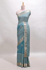Turquoise blue checked floral motifs chiffon saree with self zari border and contrast blouse