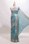 Turquoise blue checked floral motifs chiffon saree with self zari border and contrast blouse