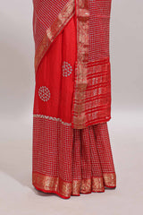 Red checked floral motifs chiffon saree with self zari border and contrast blouse