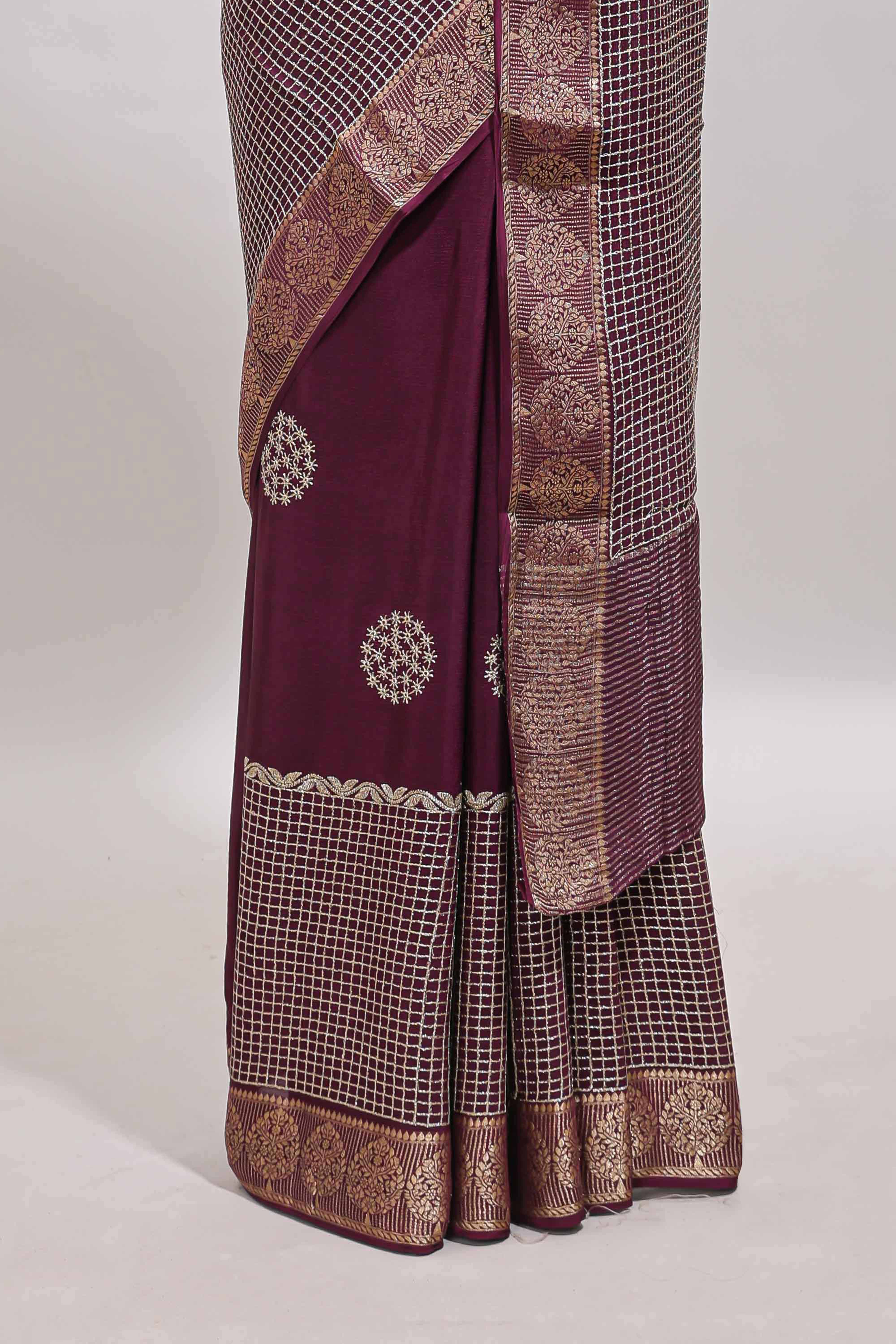 Purple checked floral motifs chiffon saree with self zari border and contrast blouse