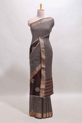 Brown checked floral motifs chiffon saree with self zari border and contrast blouse