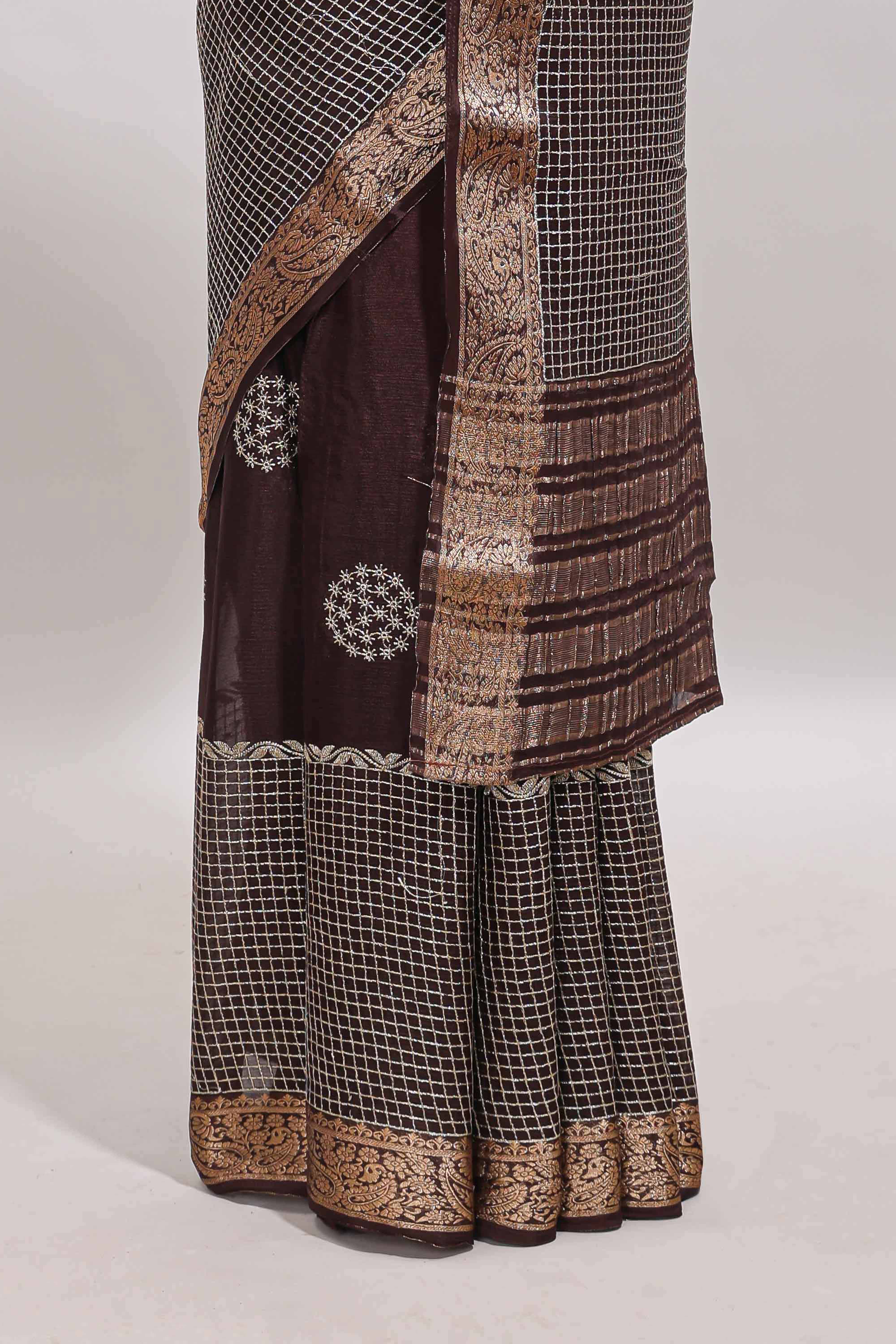 Brown checked floral motifs chiffon saree with self zari border and contrast blouse