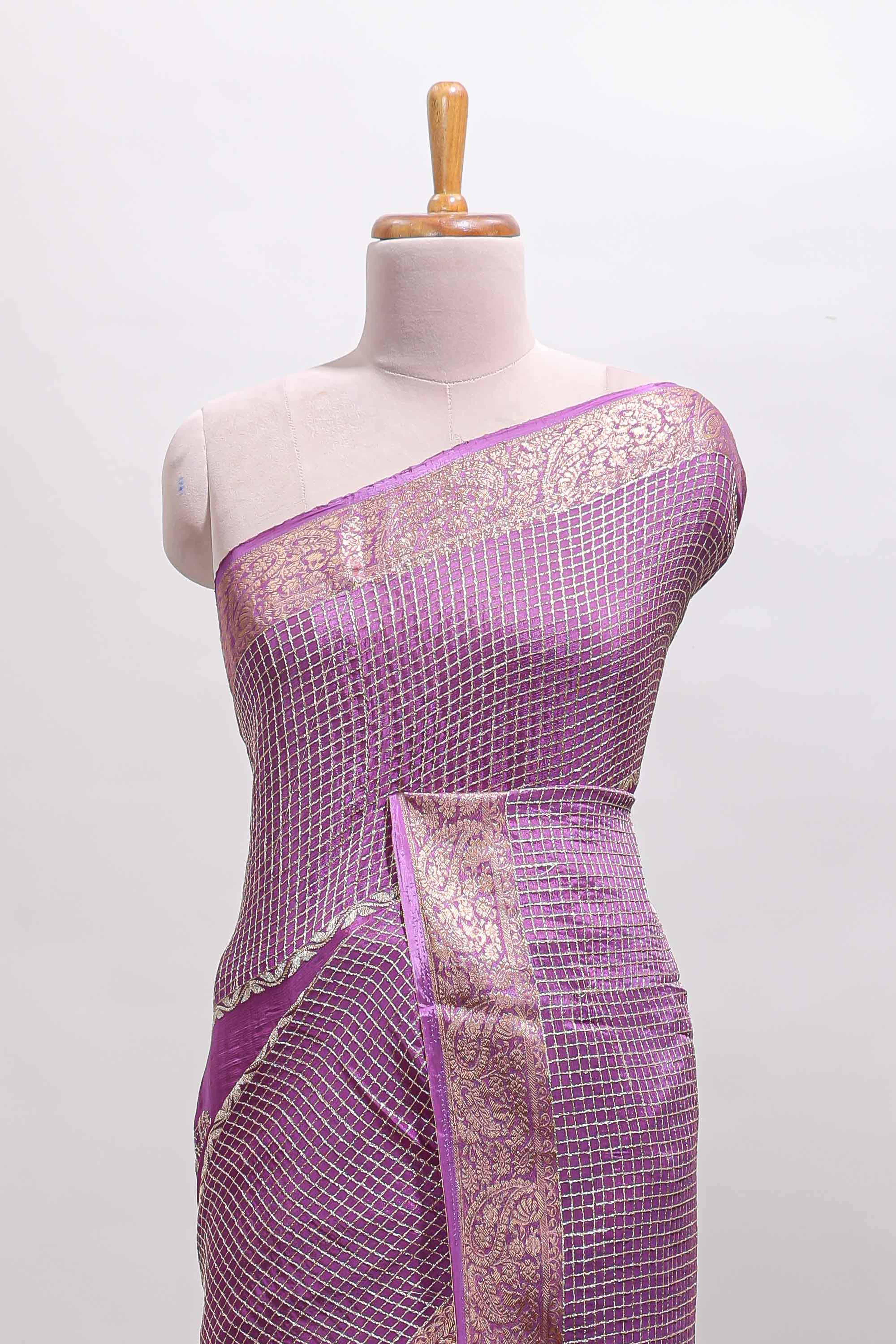 Lavender checked floral motifs chiffon saree with self zari border and contrast blouse
