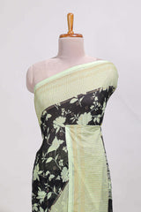 Black and green checked floral motifs chiffon saree with self zari border and contrast blouse