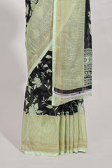 Black and green checked floral motifs chiffon saree with self zari border and contrast blouse