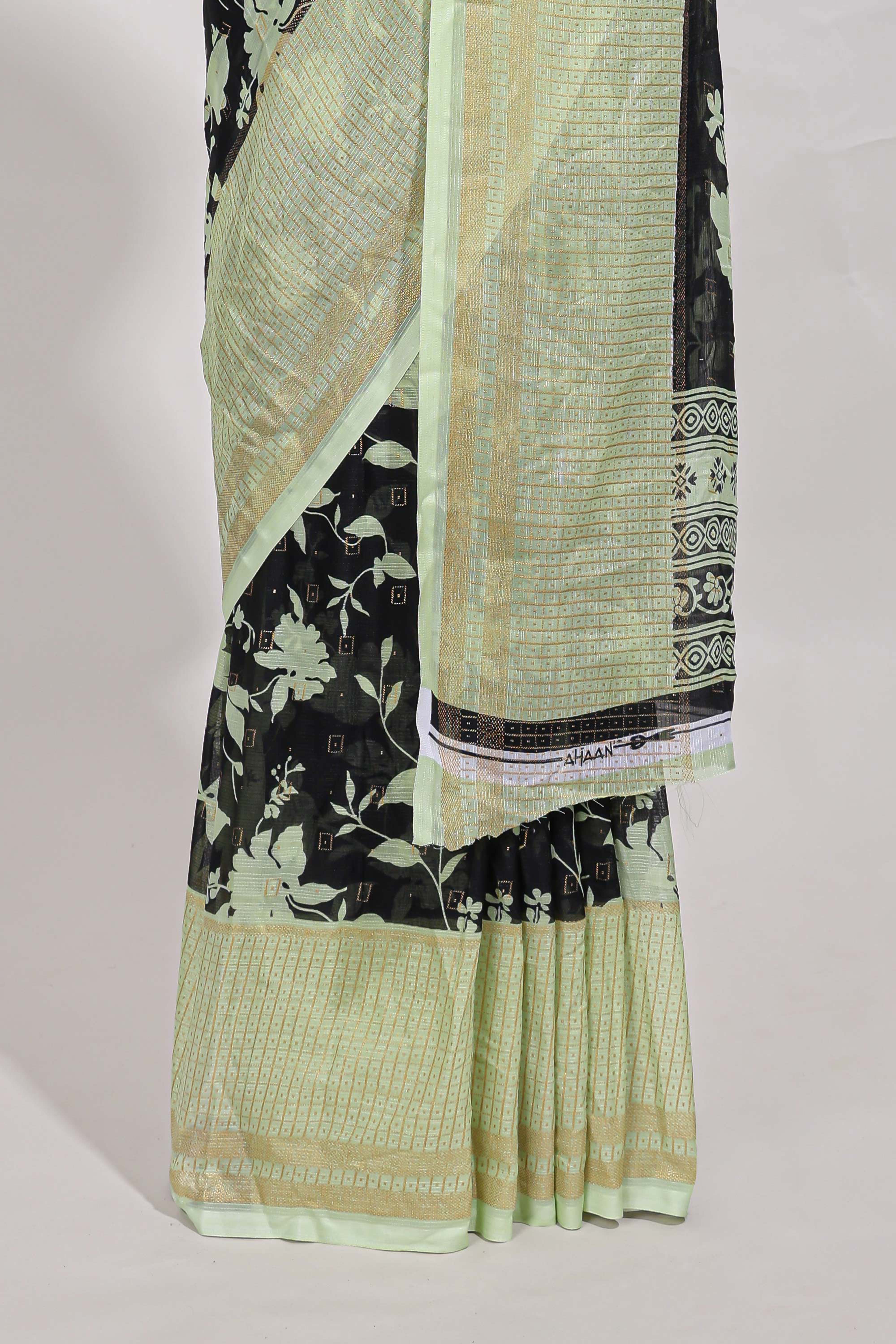 Black and green checked floral motifs chiffon saree with self zari border and contrast blouse