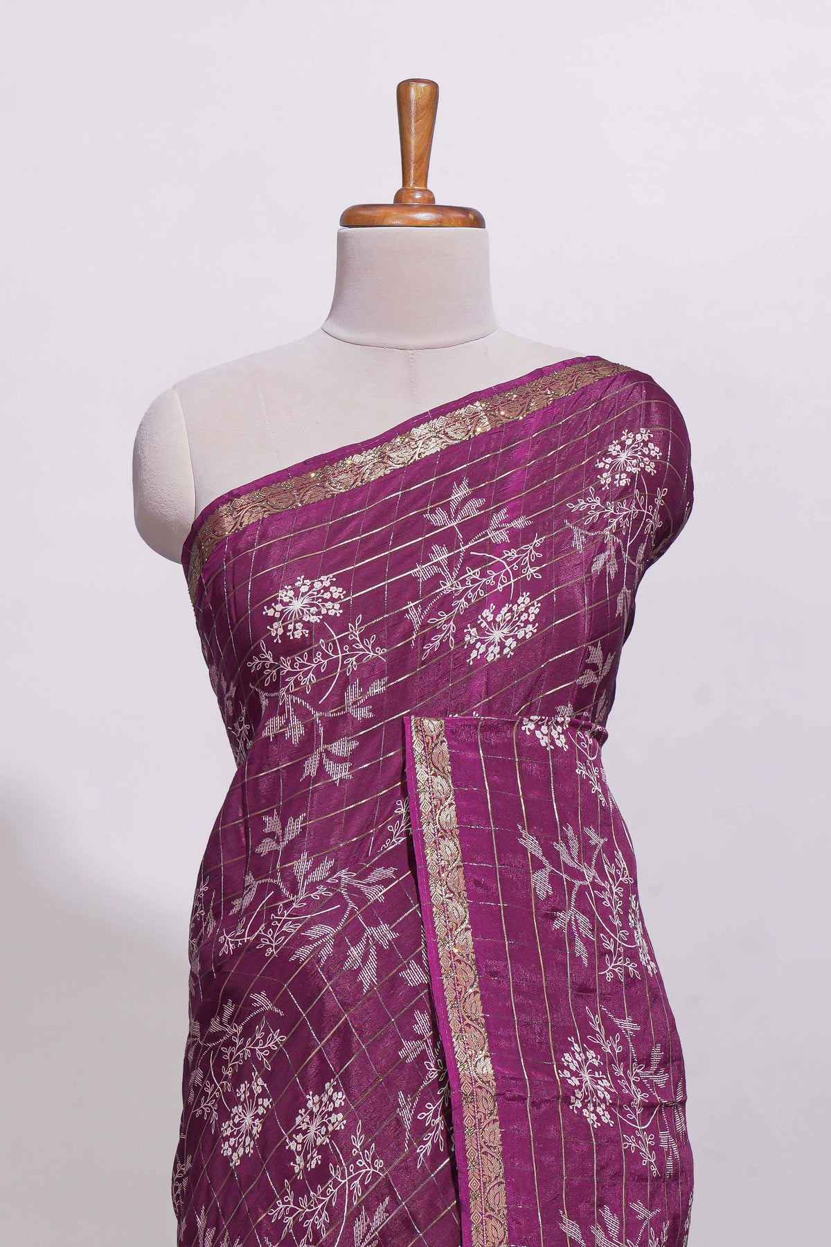 Deep plum checked with floral motifs chiffon saree with self zari border and matching blouse