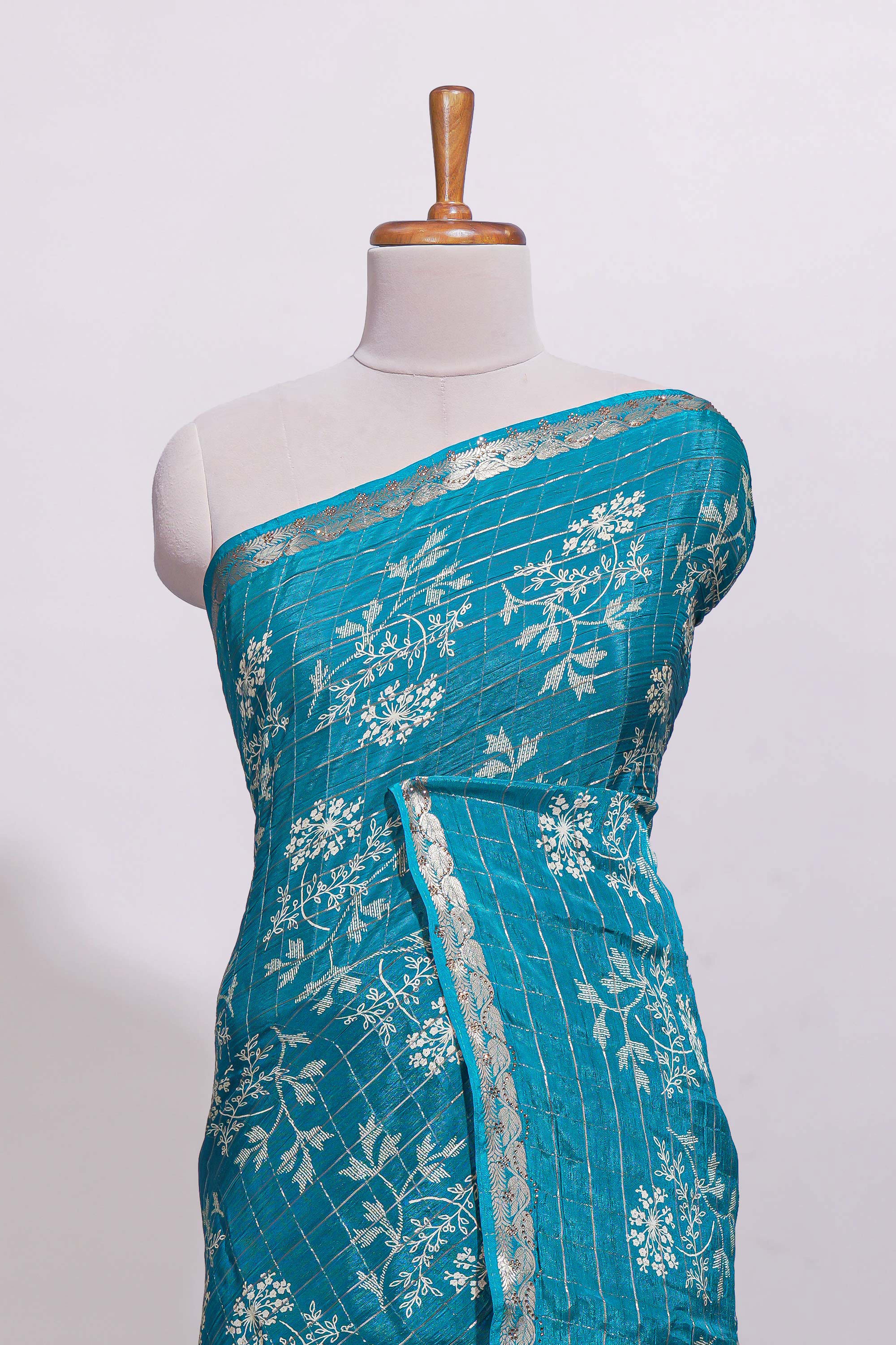 Teal blue checked with floral motifs chiffon saree with self zari border and matching blouse