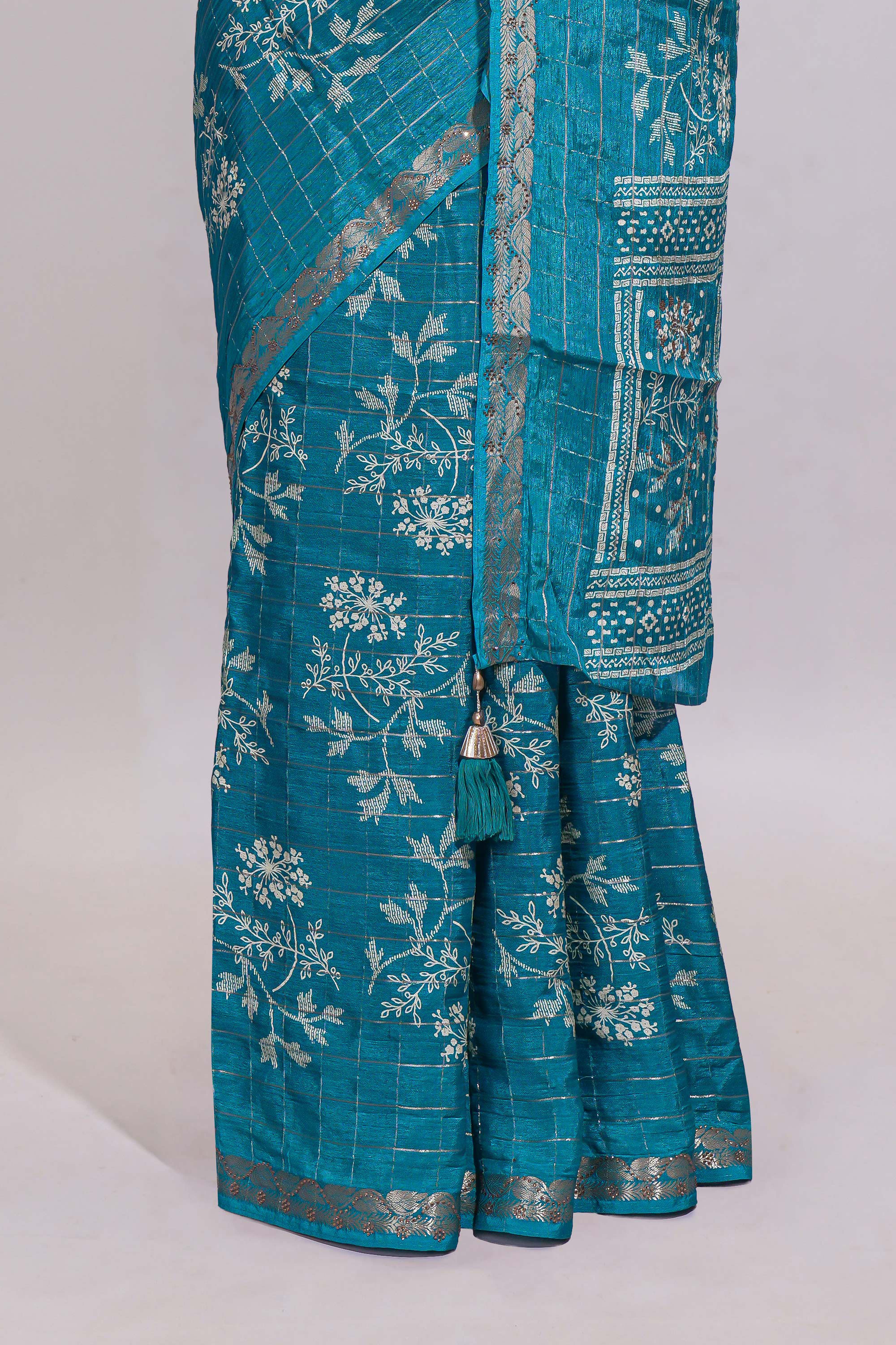 Teal blue checked with floral motifs chiffon saree with self zari border and matching blouse