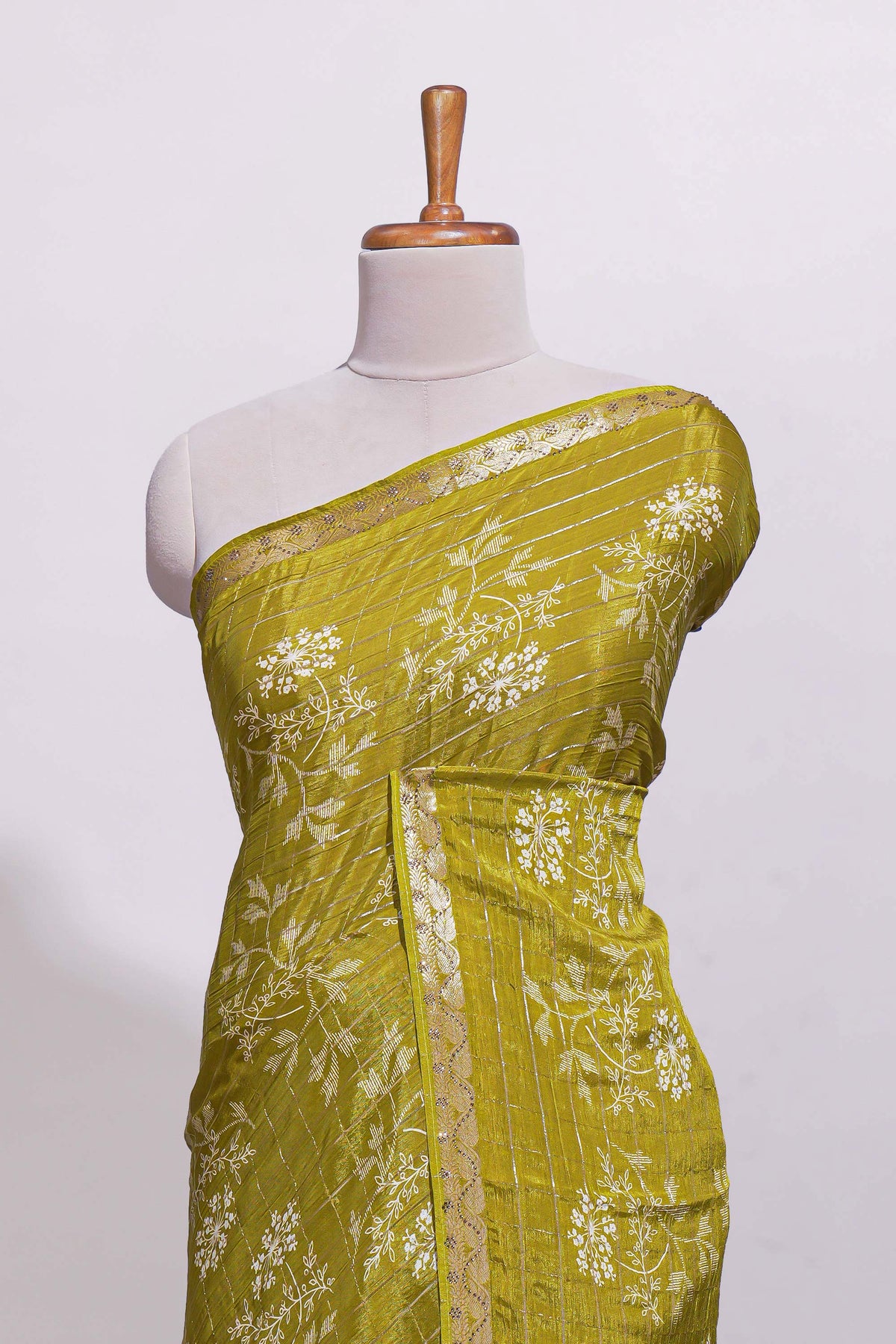 Olive green checked with floral motifs chiffon saree with self zari border and matching blouse