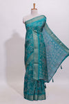 Teal green floral designed chiffon saree with self zari border and matching blouse