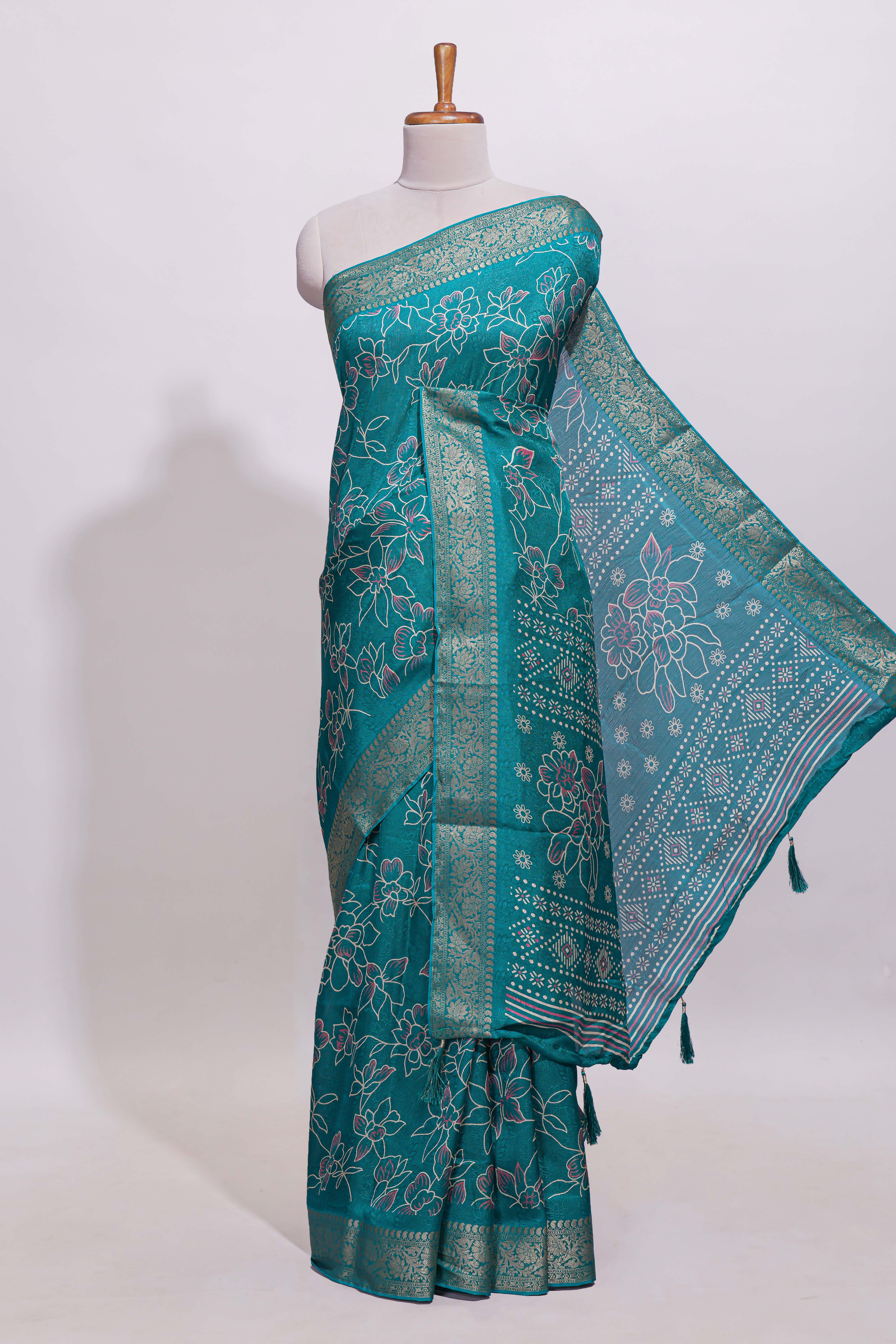 Teal green floral designed chiffon saree with self zari border and matching blouse