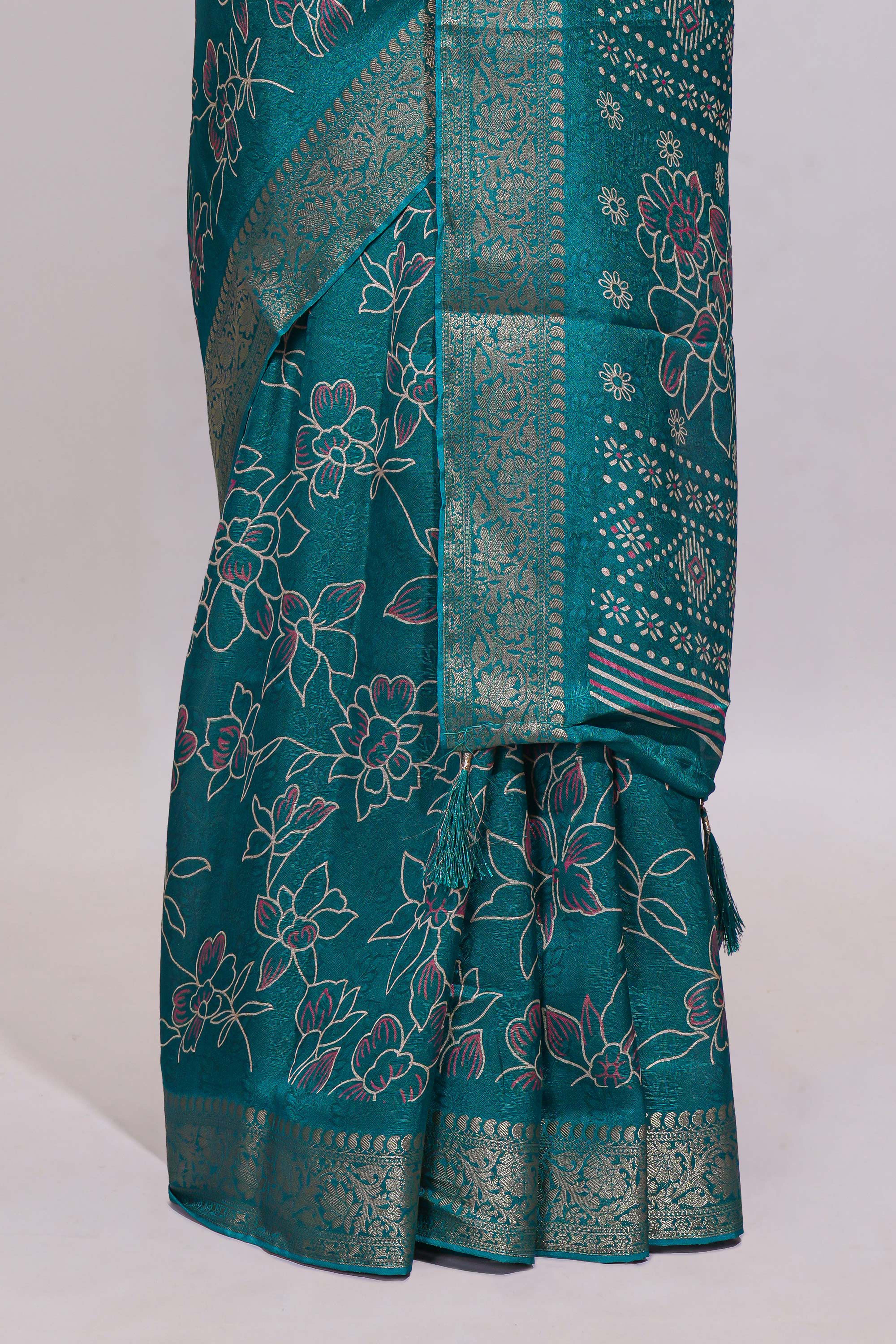 Teal green floral designed chiffon saree with self zari border and matching blouse