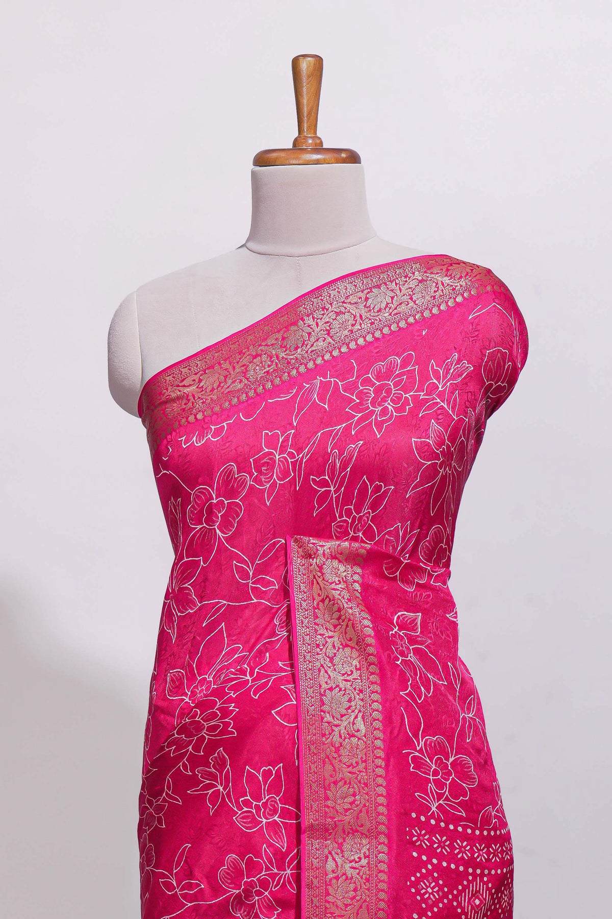 Pink floral designed chiffon saree with self zari border and matching blouse