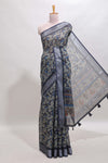 Dark sea green geometric design chanderi cotton saree with contrast zari border and printed blouse