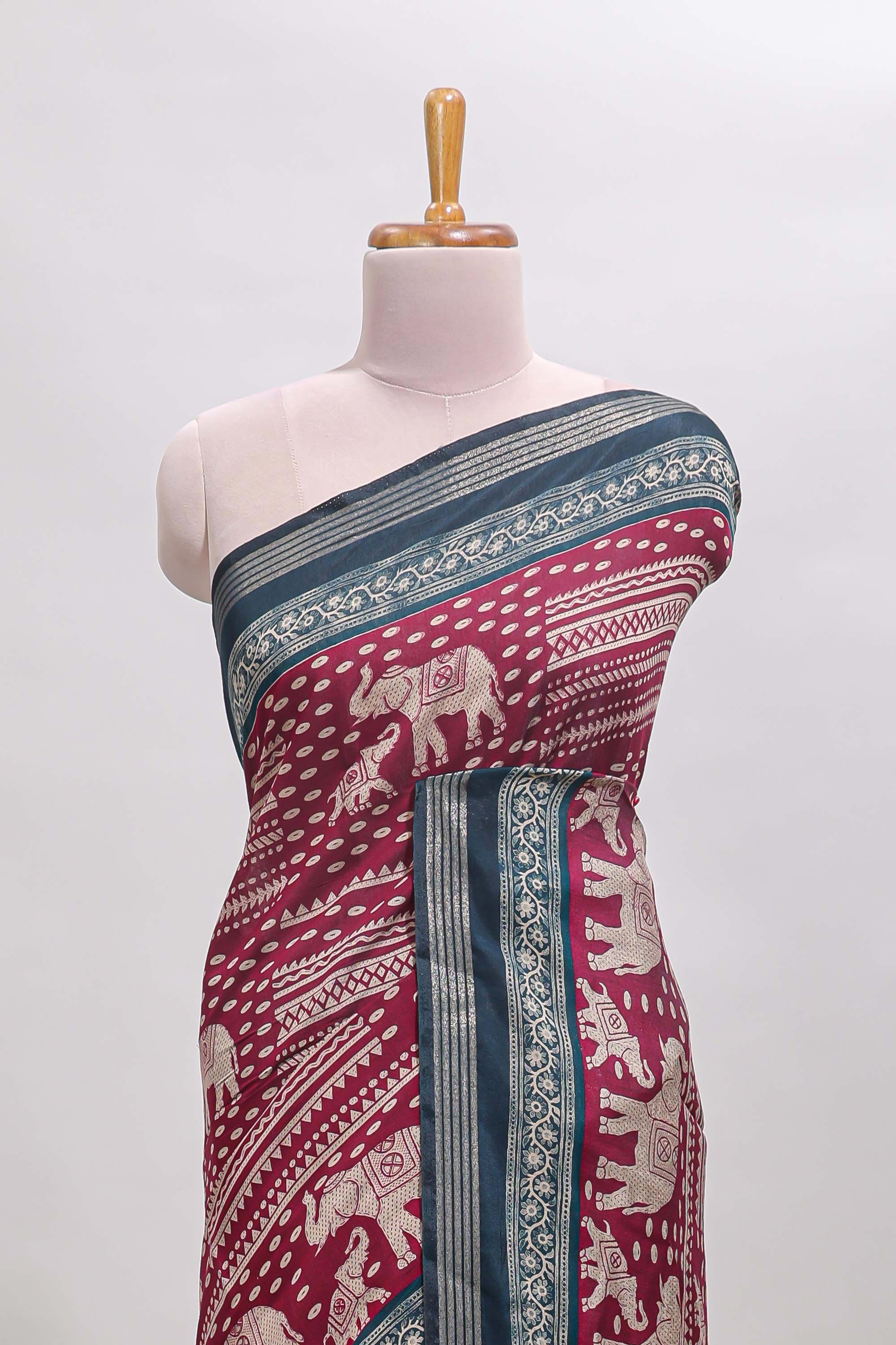 Maroon geometric & elephant motif chanderi cotton saree with contrast border and chevron blouse