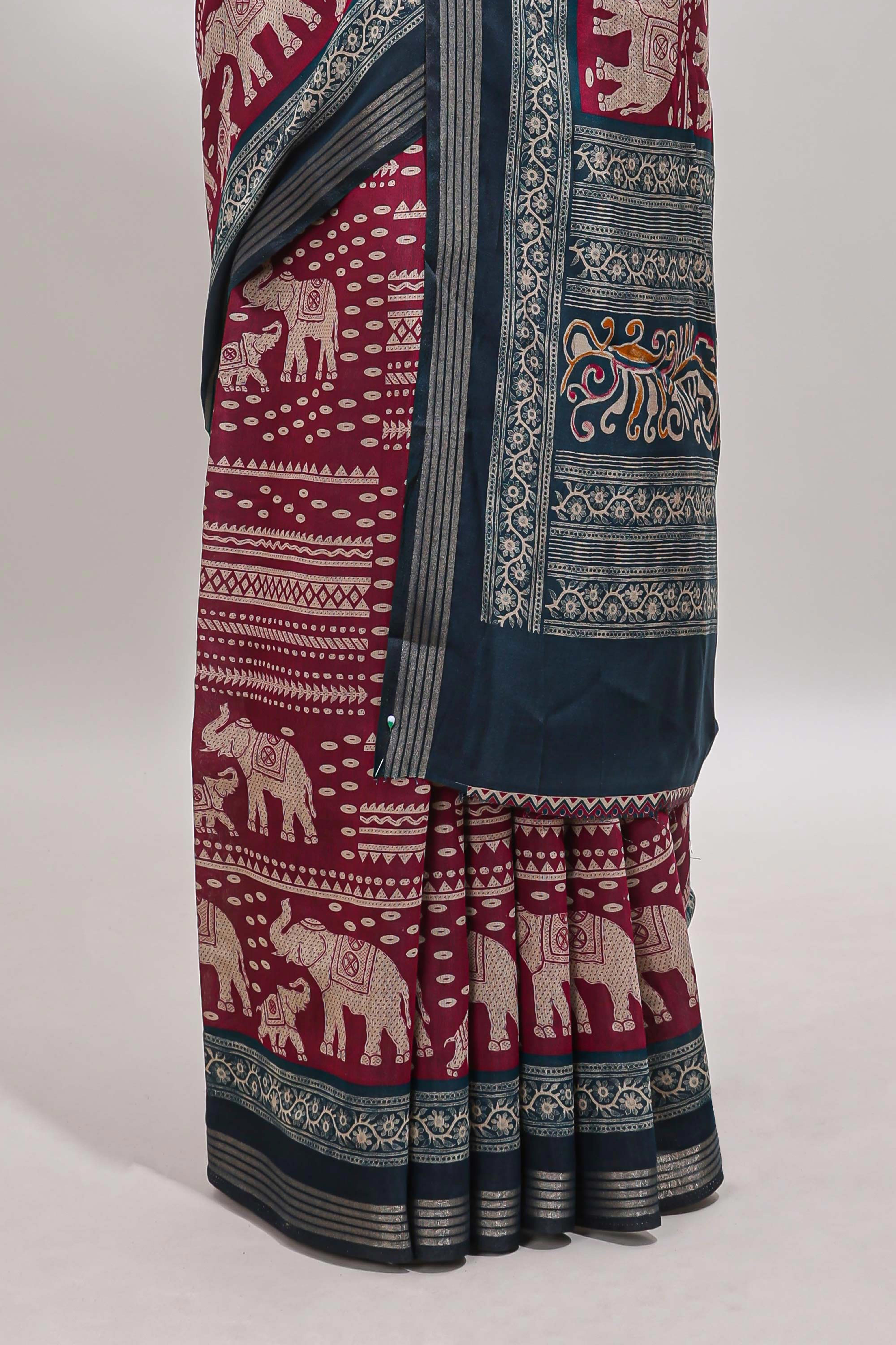 Maroon geometric & elephant motif chanderi cotton saree with contrast border and chevron blouse