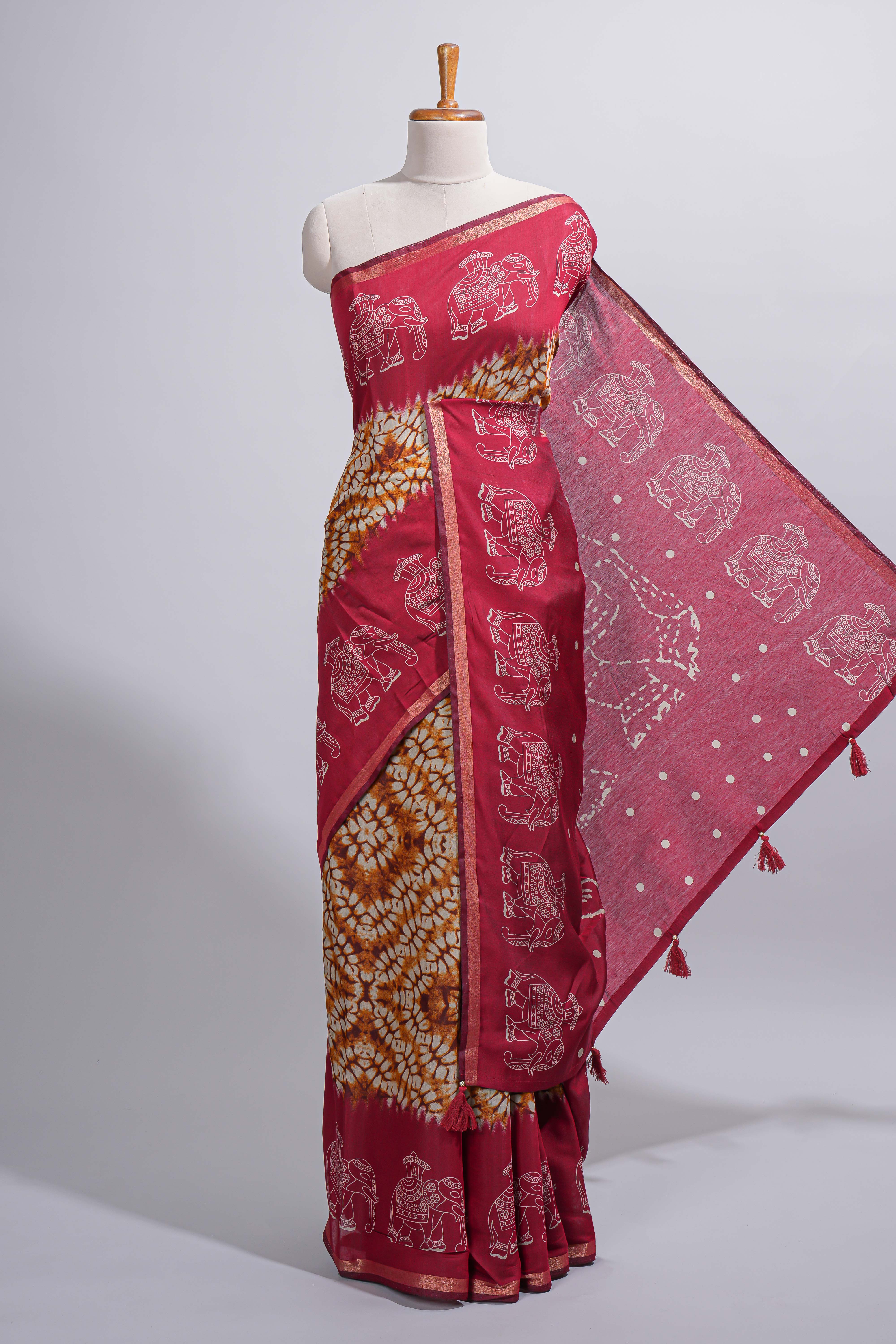 Mustard yellow Chanderi cotton saree with elephant motifs tie and dye effect patterns and contrast zari border along with printed blouse