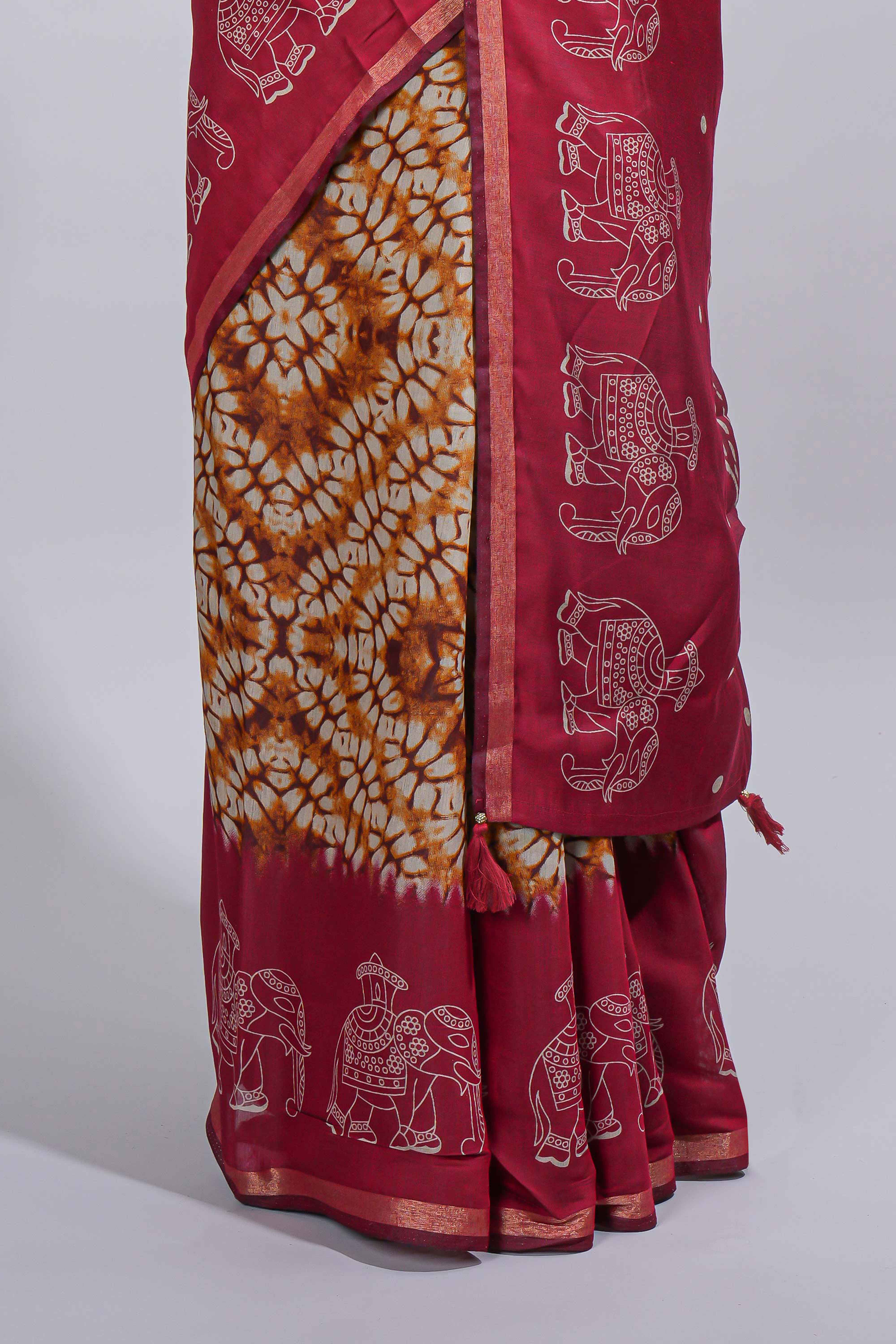 Mustard yellow Chanderi cotton saree with elephant motifs tie and dye effect patterns and contrast zari border along with printed blouse