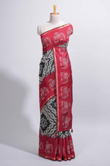 Black Chanderi cotton saree with elephant motifs tie and dye effect patterns and contrast zari border along with printed blouse