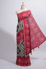 Black Chanderi cotton saree with elephant motifs tie and dye effect patterns and contrast zari border along with printed blouse