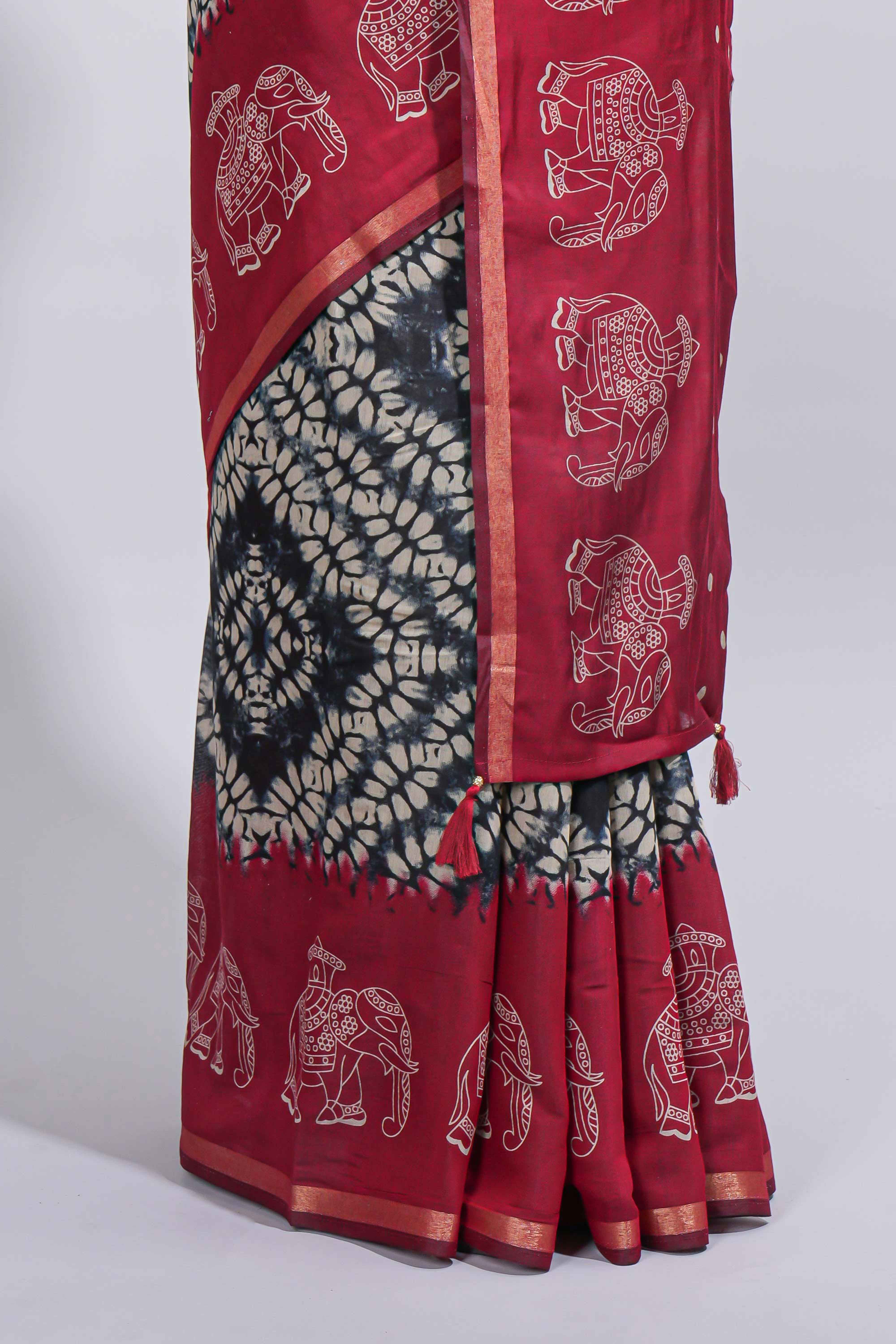 Black Chanderi cotton saree with elephant motifs tie and dye effect patterns and contrast zari border along with printed blouse