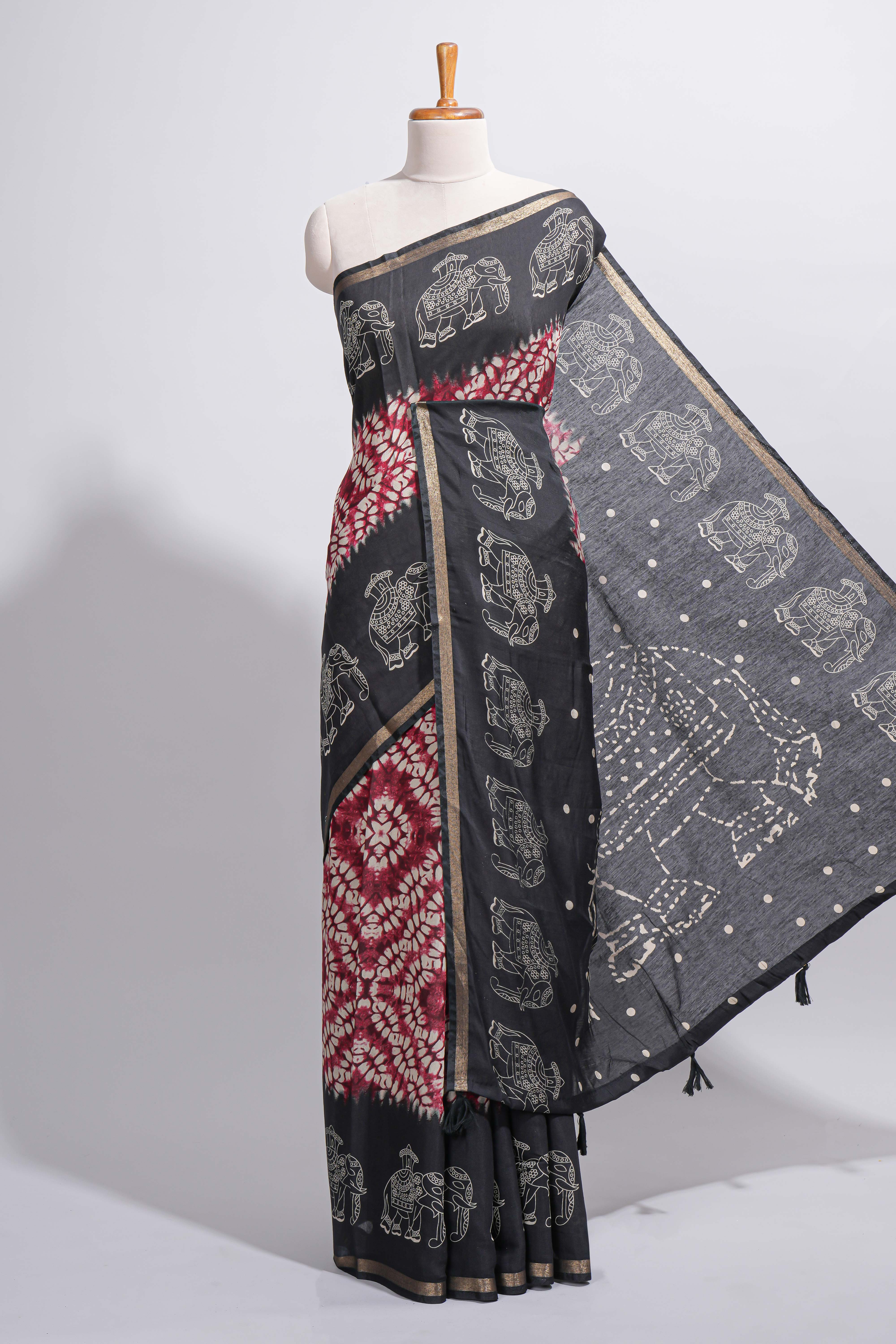 Maroon Chanderi cotton saree with elephant motifs tie and dye effect patterns and contrast zari border along with printed blouse