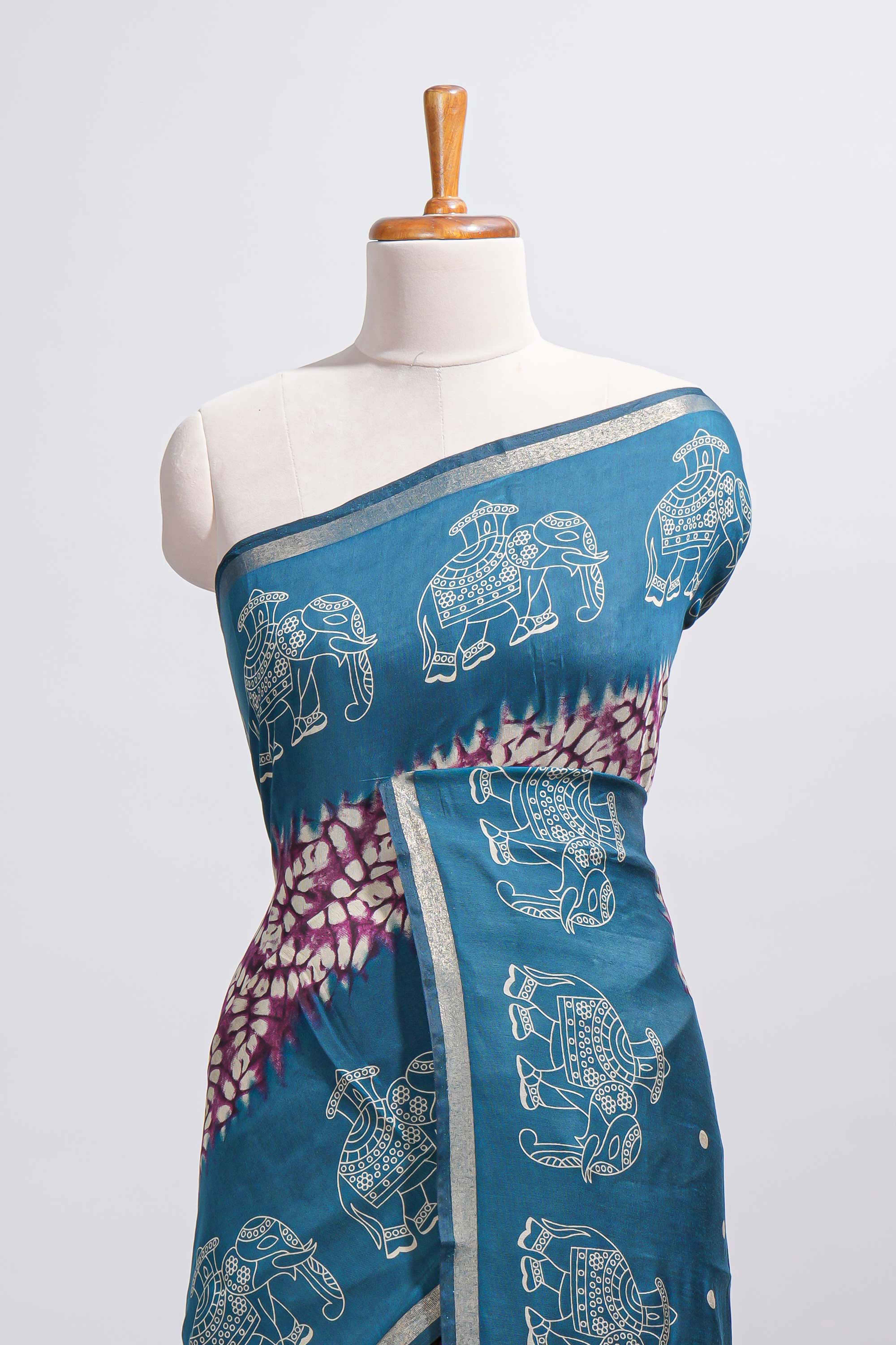 Purple Chanderi cotton saree with elephant motifs tie and dye effect patterns and contrast zari border along with printed blouse
