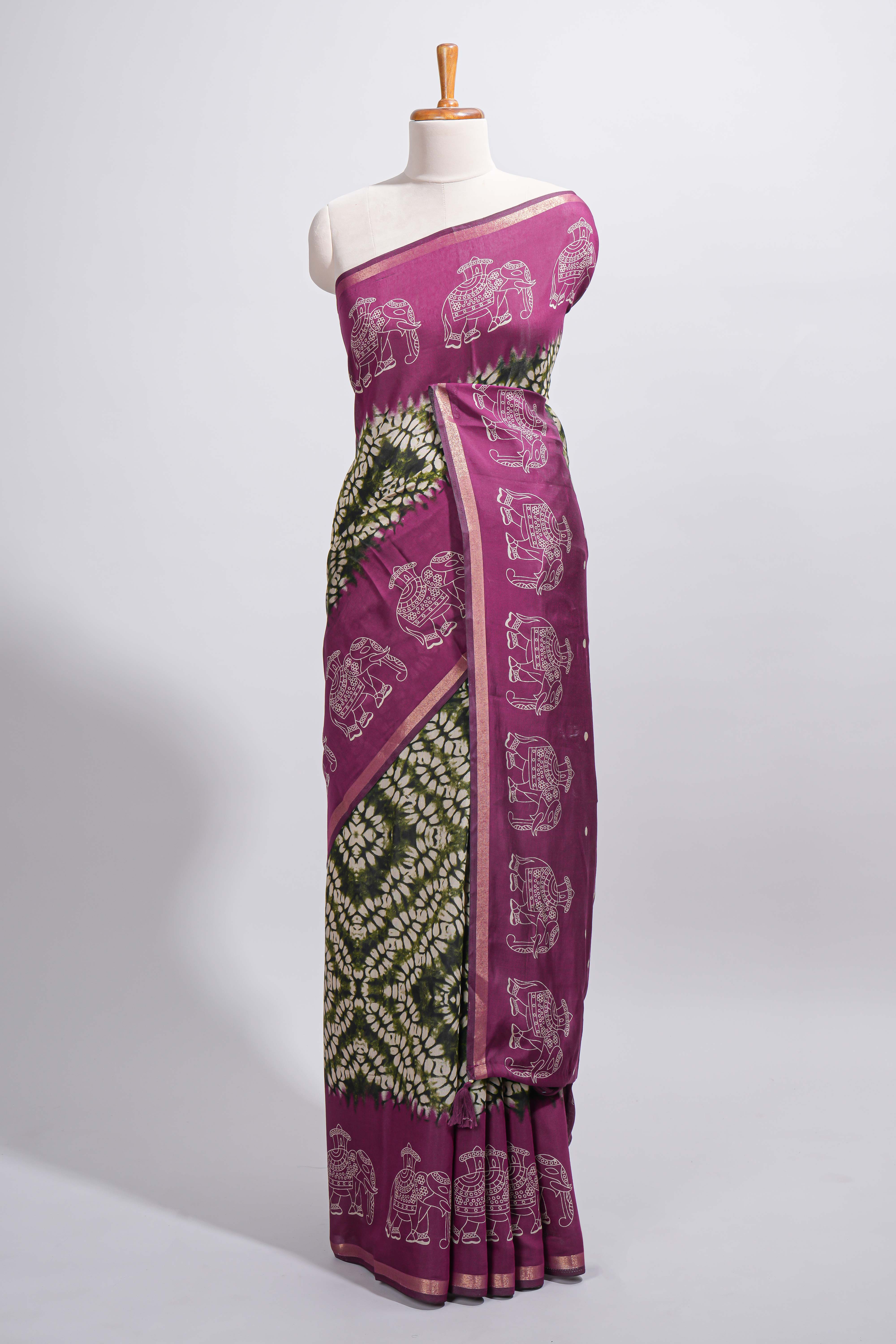 Dark green Chanderi cotton saree with elephant motifs tie and dye effect patterns and contrast zari border along with printed blouse