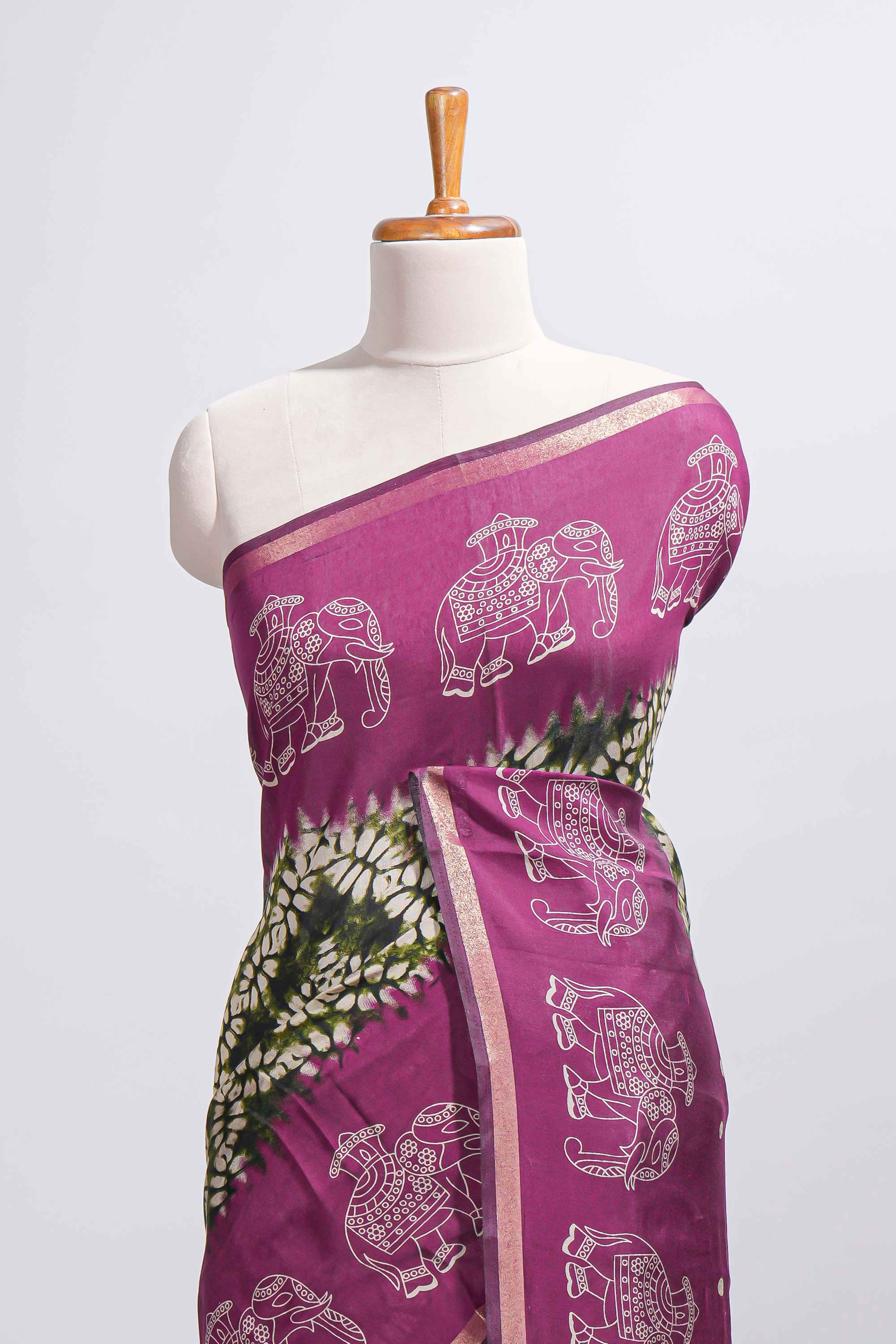 Dark green Chanderi cotton saree with elephant motifs tie and dye effect patterns and contrast zari border along with printed blouse