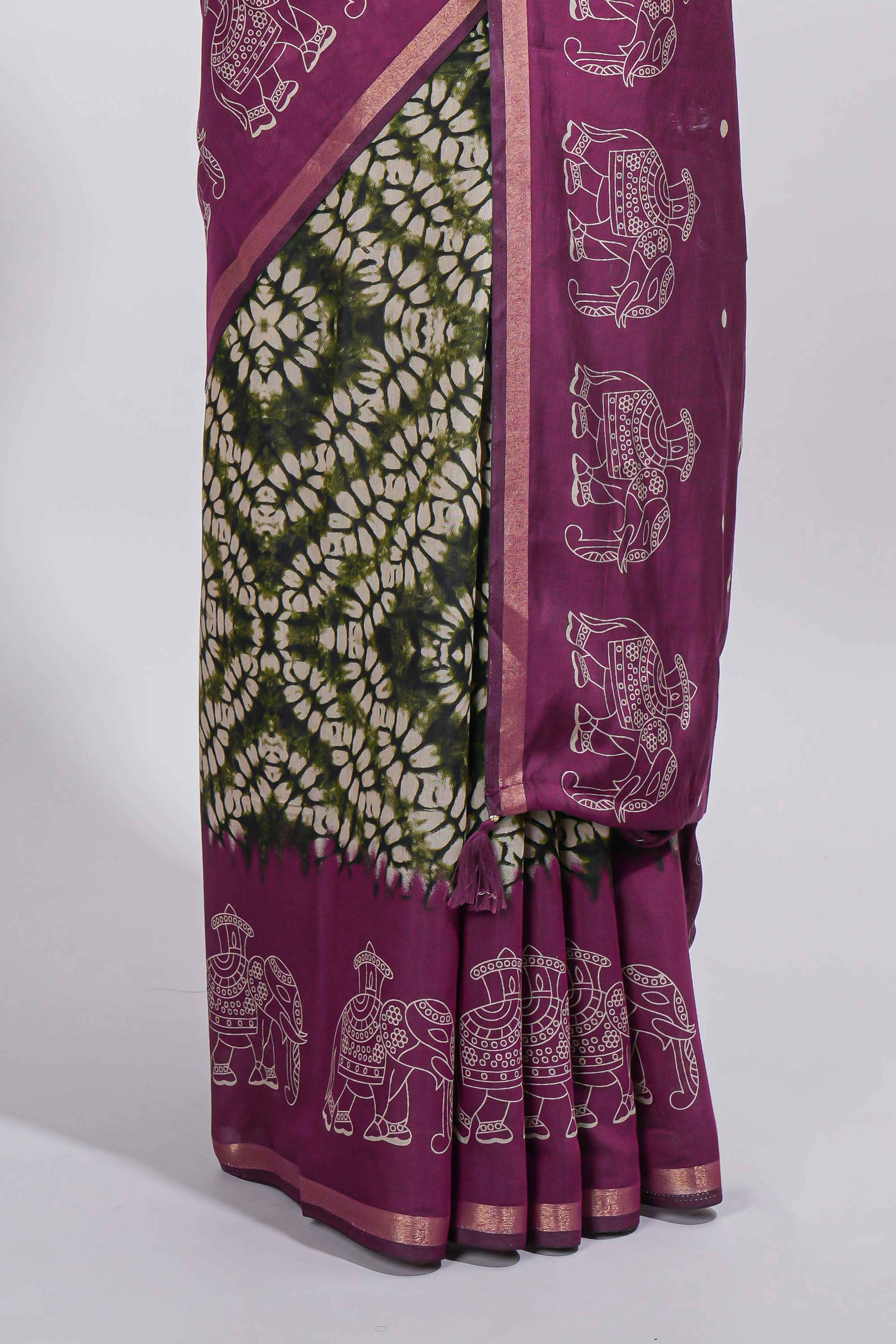 Dark green Chanderi cotton saree with elephant motifs tie and dye effect patterns and contrast zari border along with printed blouse