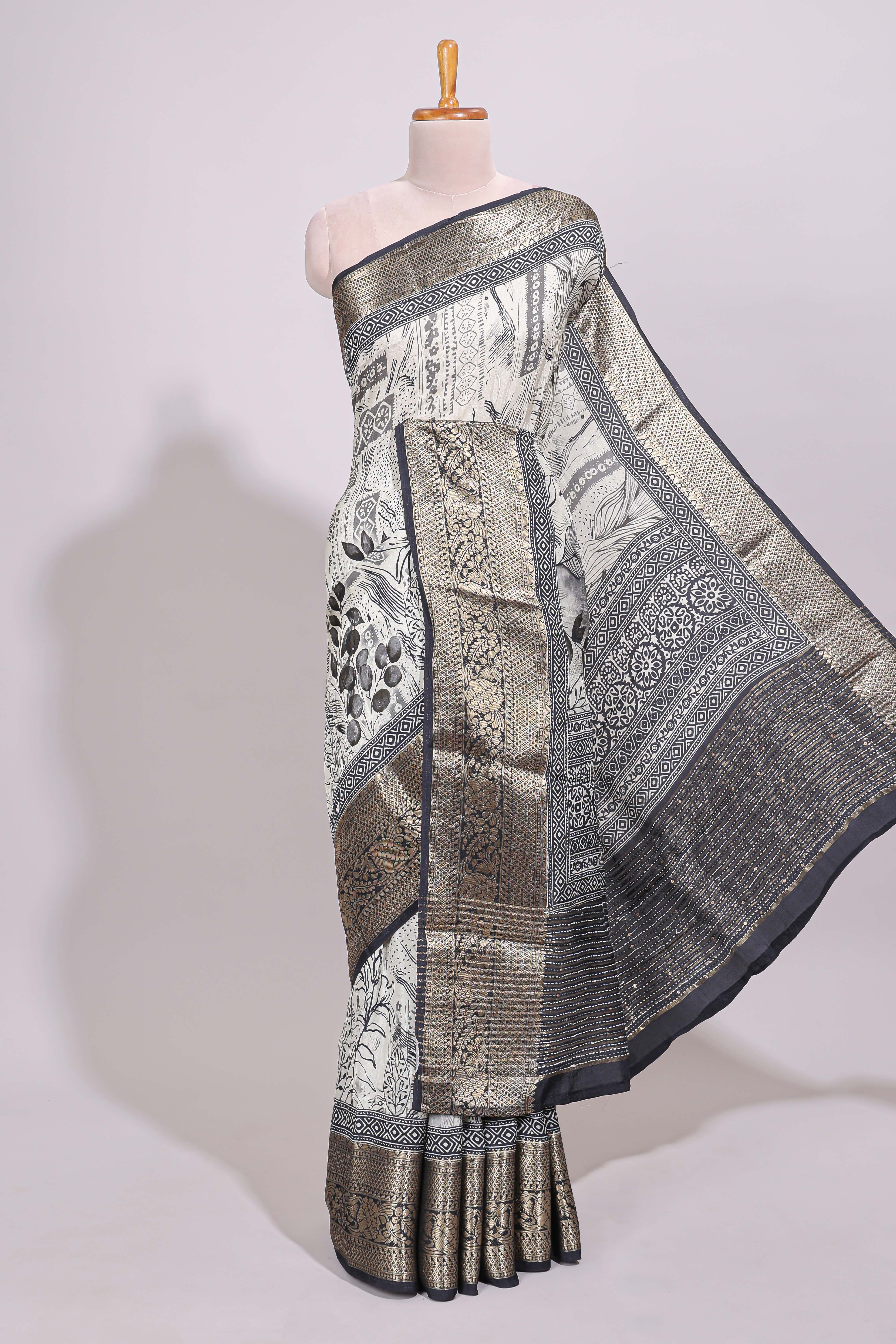 Cream floral design Chanderi cotton saree with contrast zari border and zari motifs blouse
