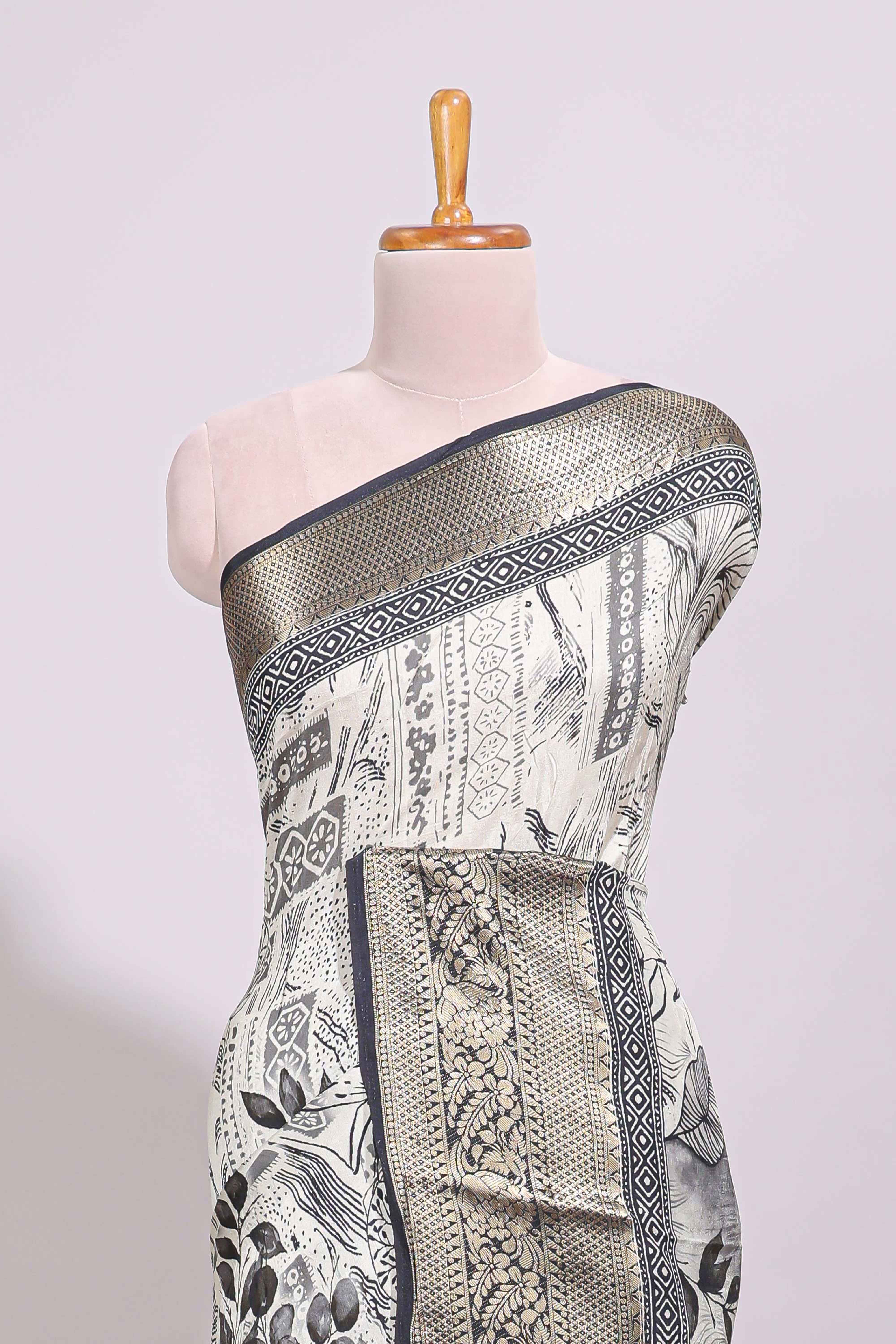Cream floral design Chanderi cotton saree with contrast zari border and zari motifs blouse