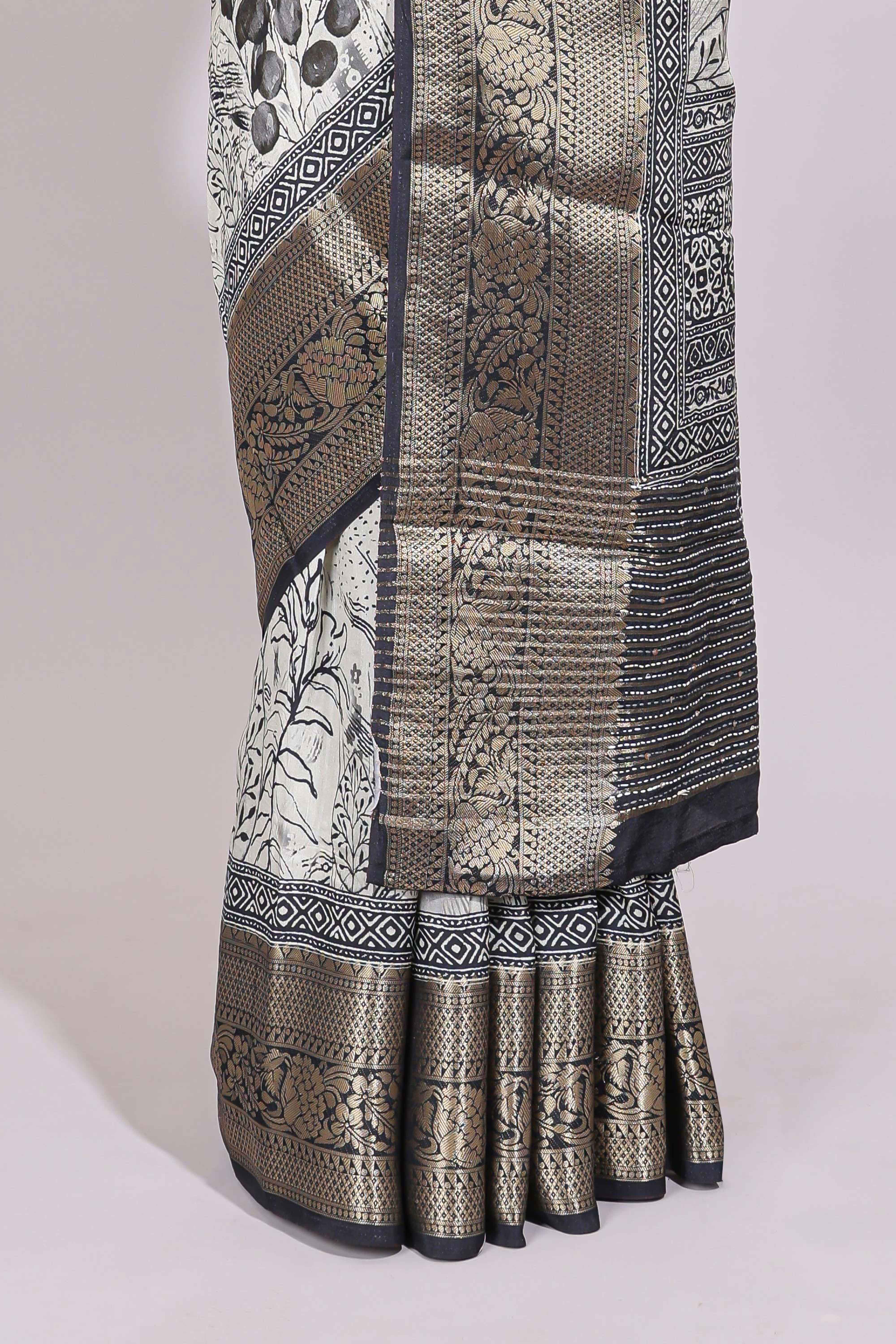 Cream floral design Chanderi cotton saree with contrast zari border and zari motifs blouse