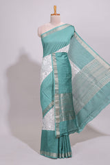 White floral design Chanderi cotton saree with contrast turquoise green zari border and floral print blouse