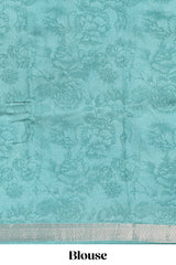 White floral design Chanderi cotton saree with contrast turquoise green zari border and floral print blouse