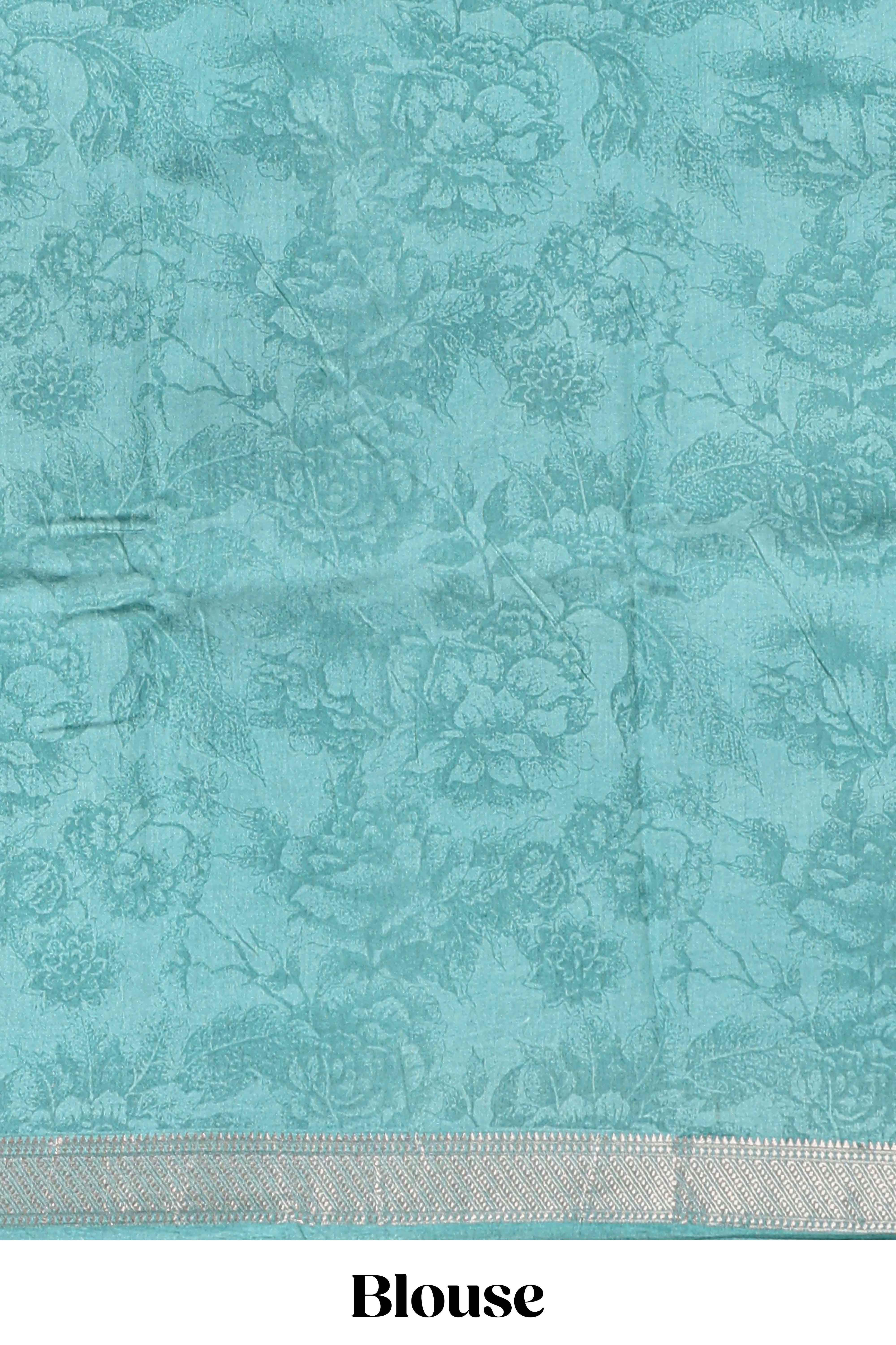 White floral design Chanderi cotton saree with contrast turquoise green zari border and floral print blouse