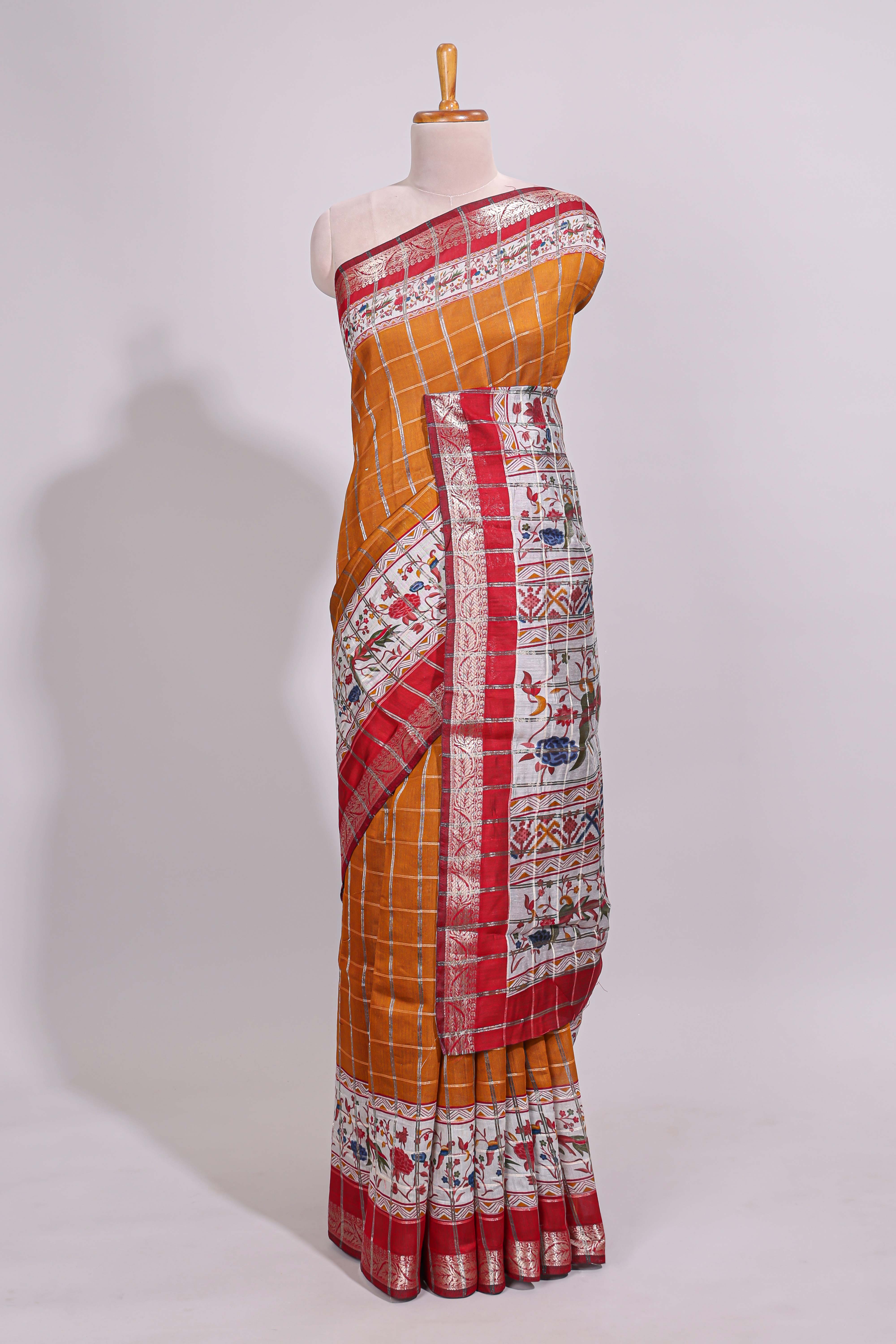 Mustard checked bottom floral design chanderi cotton saree with contrast border and checked blouse