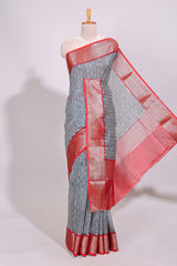 Cream geometric print design chanderi cotton saree with contrast border and striped blouse