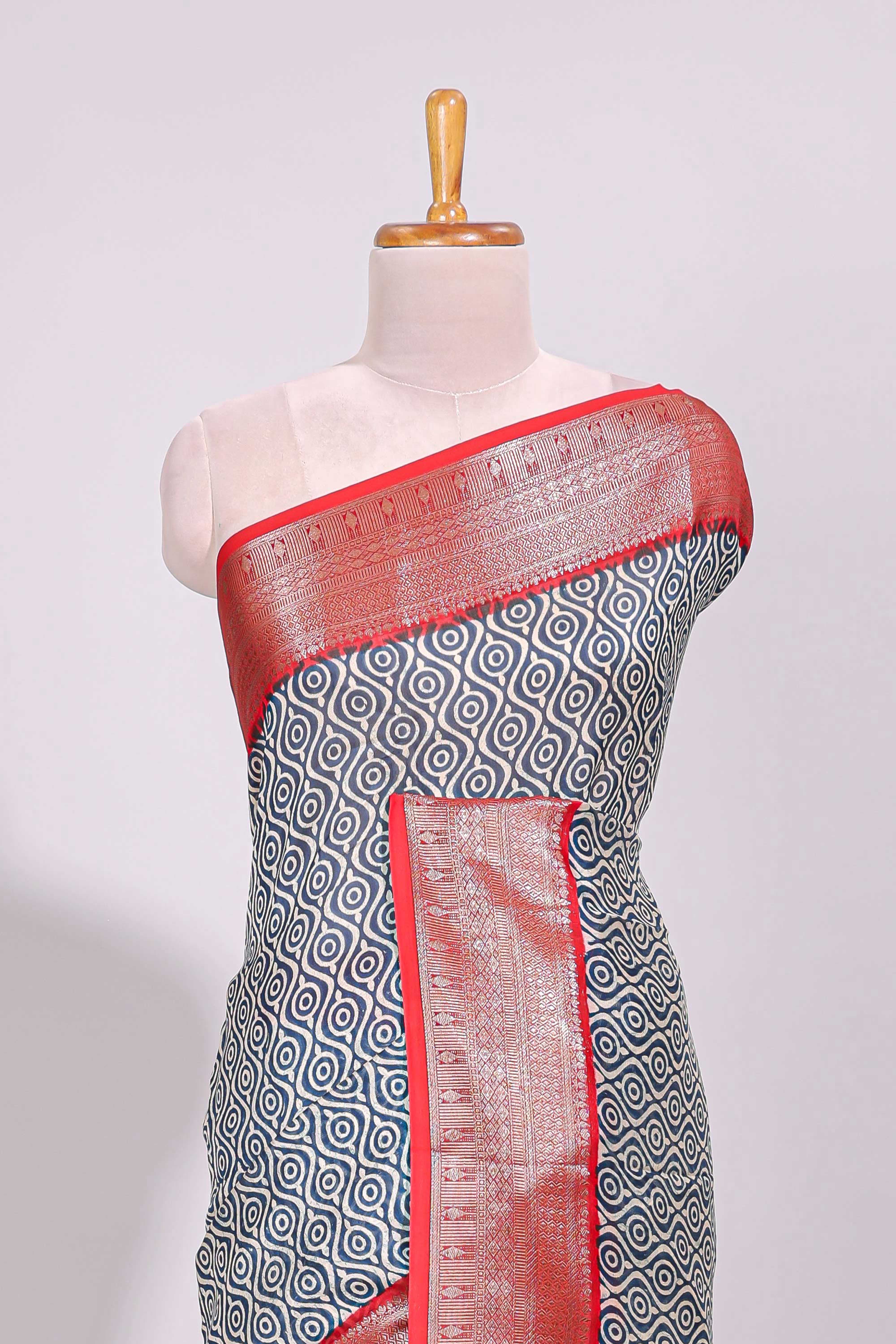 Cream geometric print design chanderi cotton saree with contrast border and striped blouse